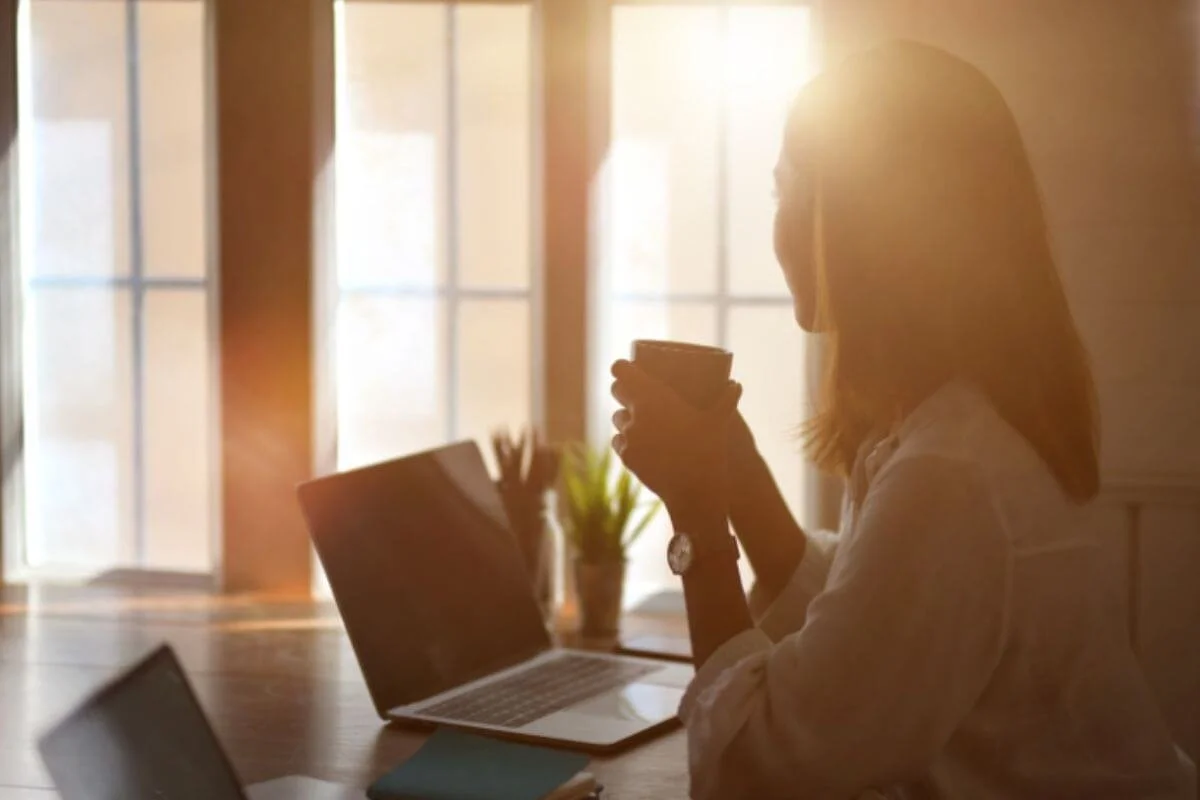 A woman drinking coffee in the morning
