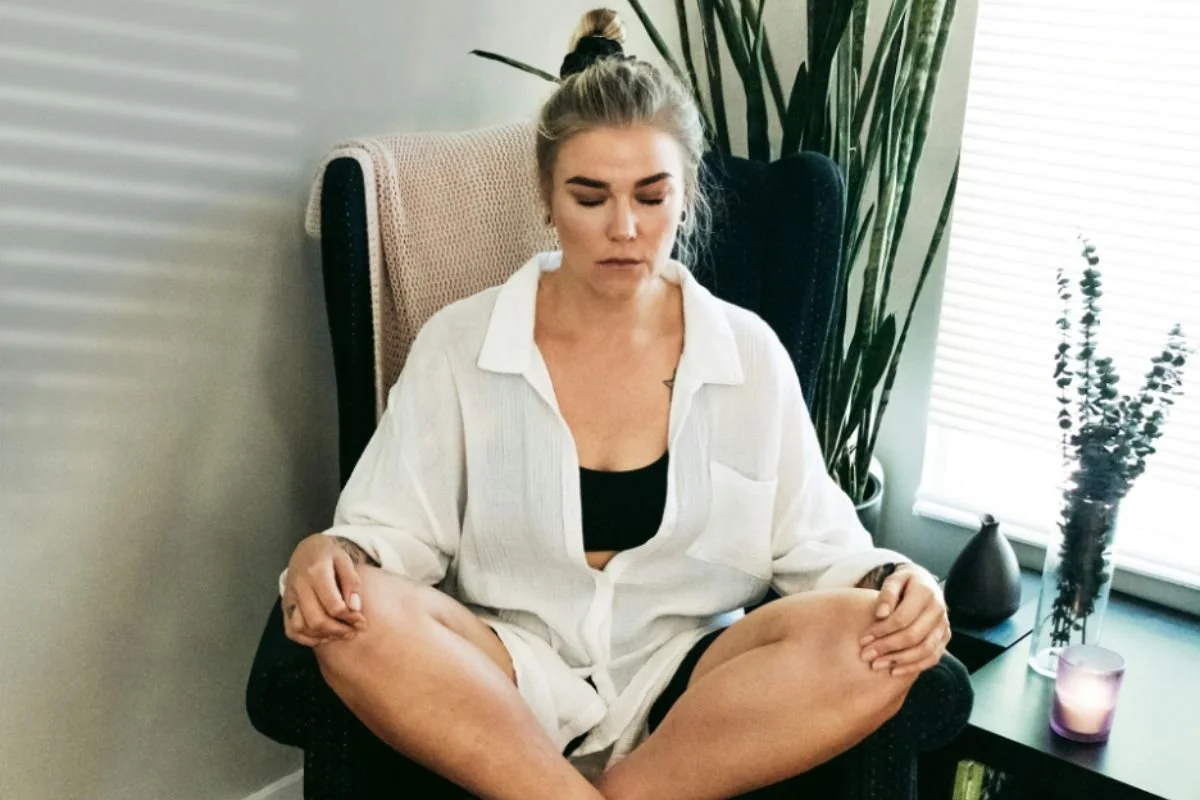 Woman meditating in her chair