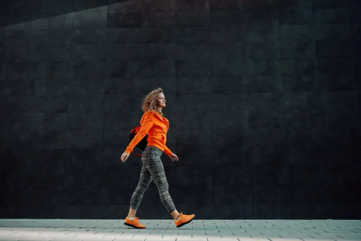 A woman walking in the streets during the day