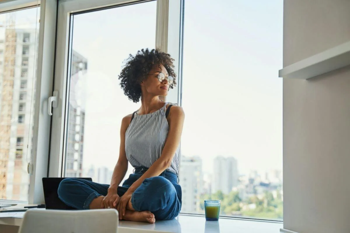 Woman staring outside the window