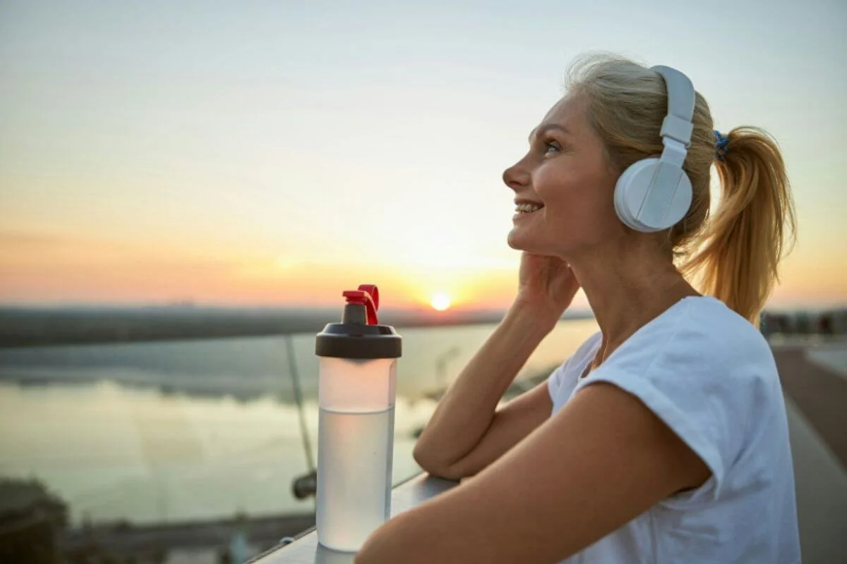A woman wearing a headset outdoor