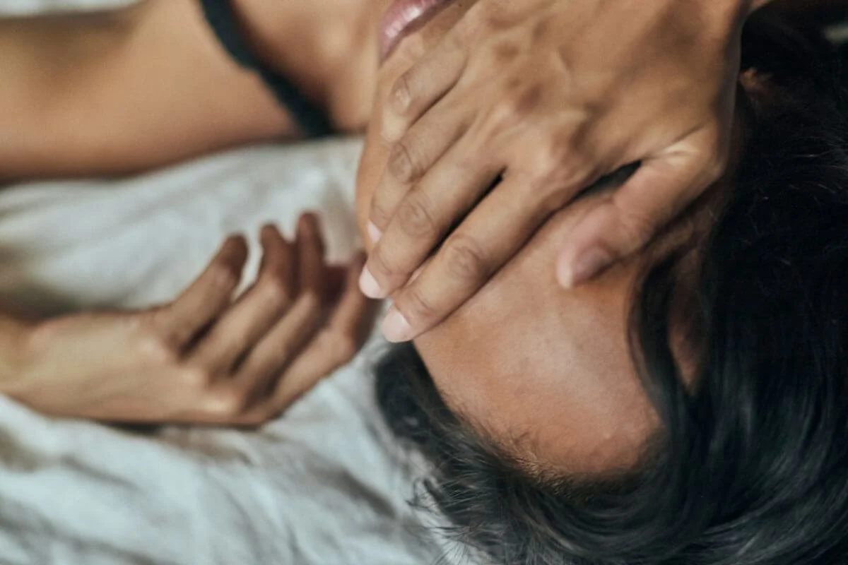 Woman covering her eyes and resting