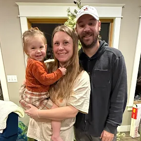 Happy toddler and family smiling after working with Indianapolis pediatric sleep consultant Counting Sleep with Courtney