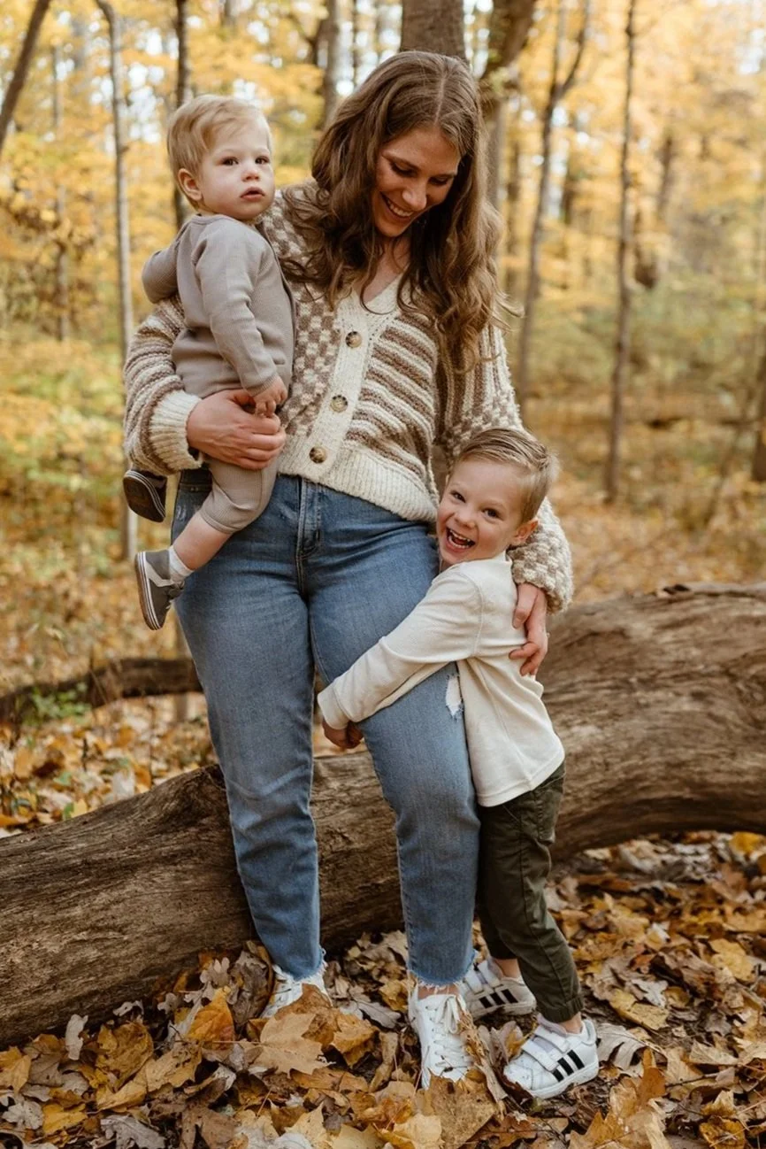 Courtney Campbell Indianapolis pediatric sleep consultant smiling outdoors with her two young sons, founder of Counting Sleep with Courtney