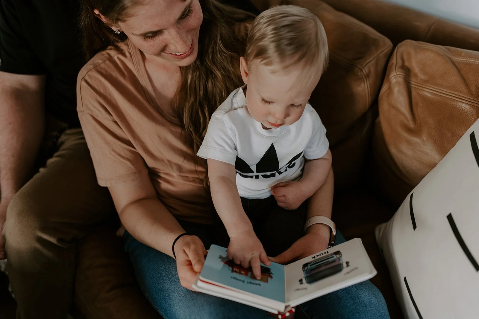 Courtney Campbell Indianapolis pediatric sleep consultant sitting with her toddler son, founder of Counting Sleep with Courtney