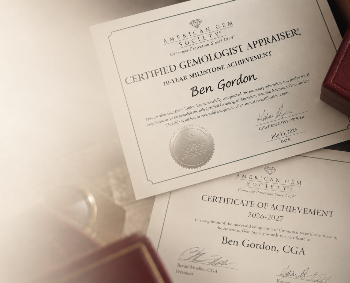 Two documents stacked showing the certifications of Jewelry Judge Ben Gordon, issued by the American Gem Society. A beige gradient overlays the image softly.