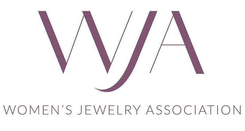 Logo of the Women's Jewelry Association featuring stylized initials 'WJA' in purple with the full name underneath.