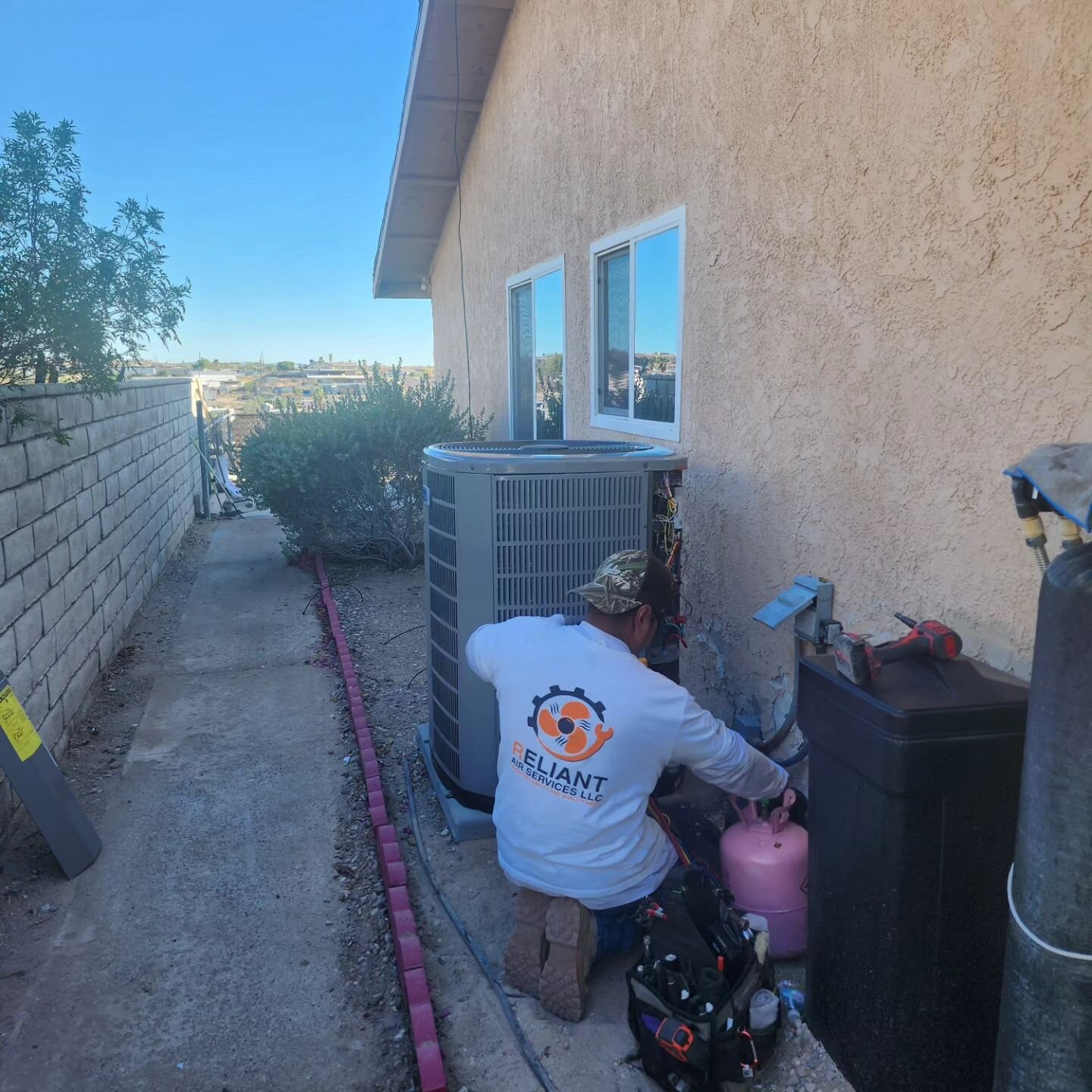 Service Tech Ramirez putting the final touches on a 16 Seer 2-stage Heat Pump, ACONT 824 Thermostst, Tem6 variable speed Air Handler. This Gold Series Heat Pump made by American Standard and Trane Technologies offers the best in comfort solutions for