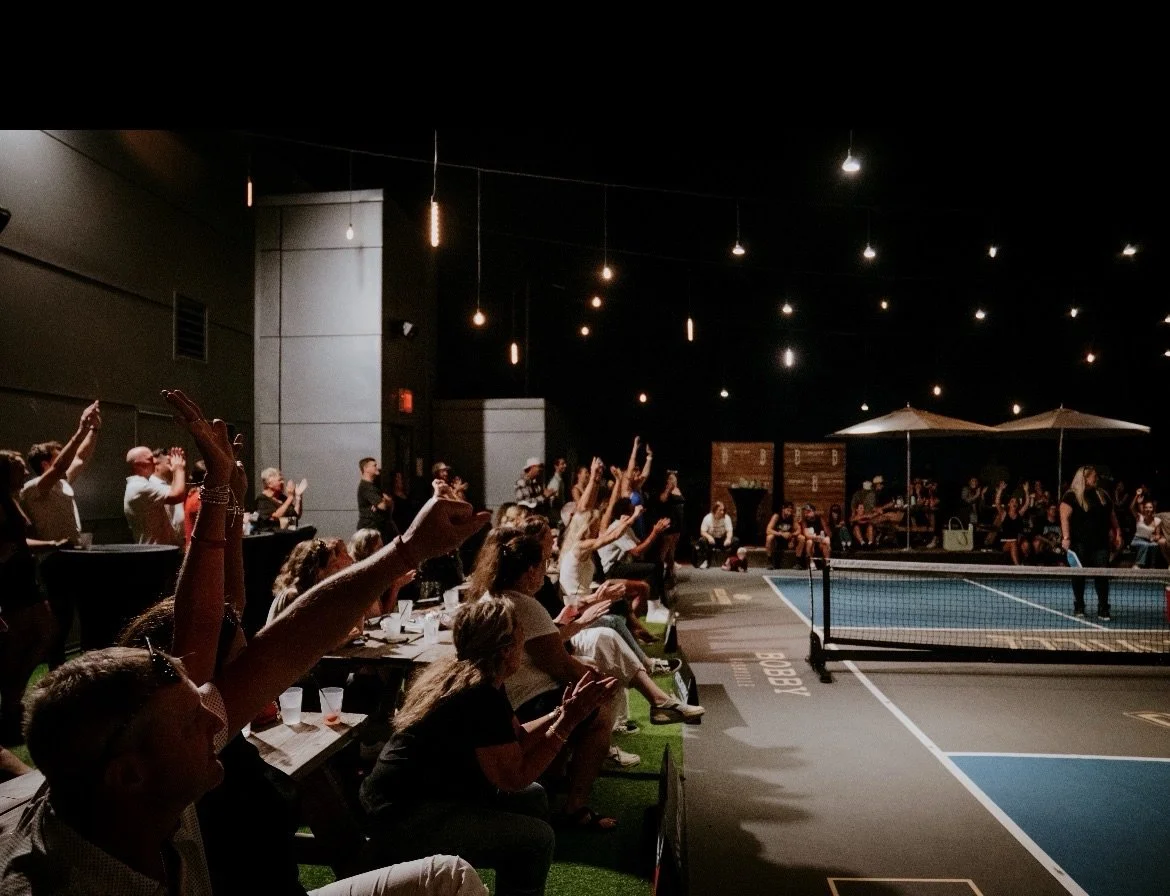 Crowd Raising Hands Rooftop Celeb.jpeg