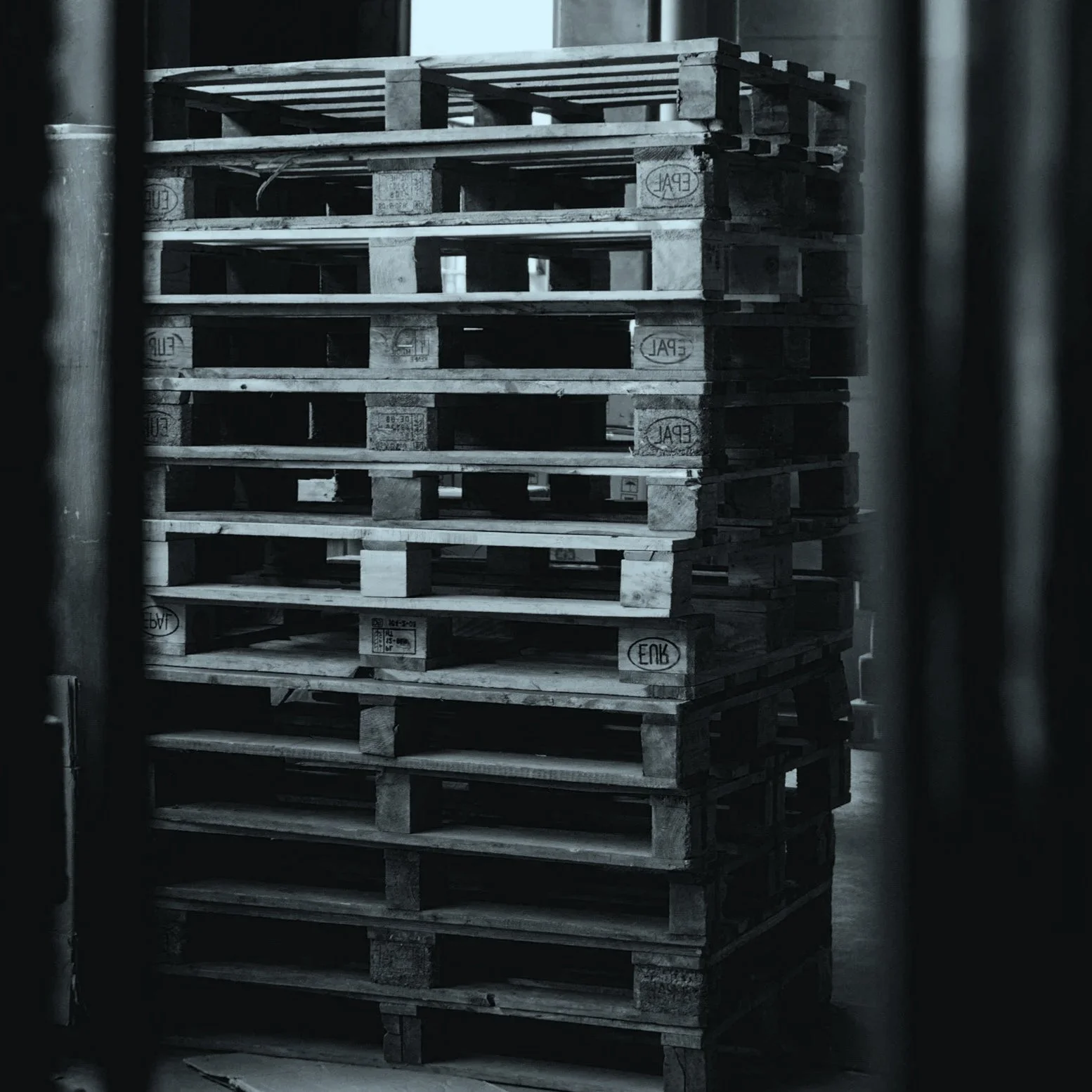 Stack of pallets with a blue overlay