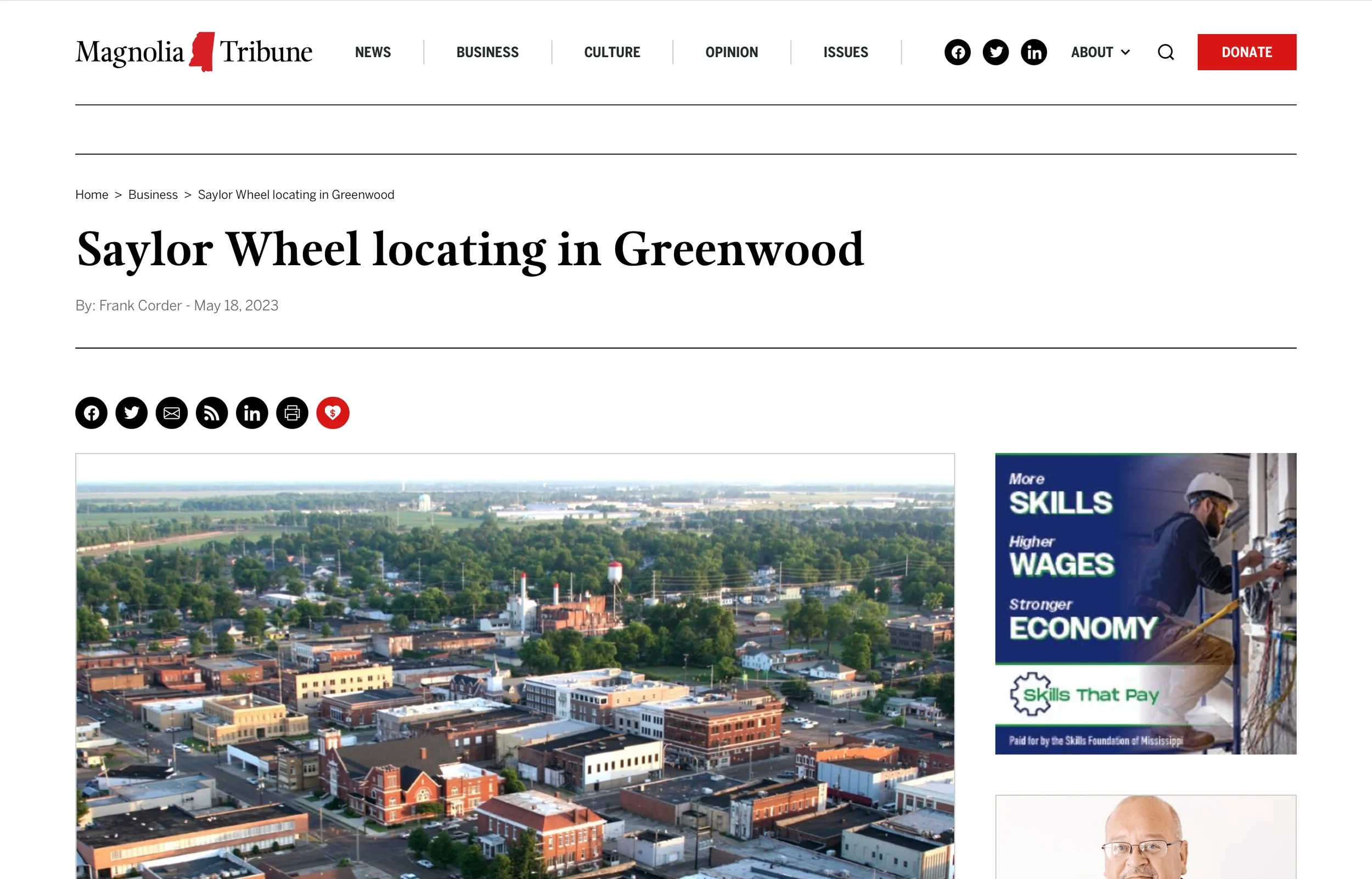 Screenshot of magnolia tribune webpage with an article titled ‘Saylor wheel locating in Greenwood’ and a photo of Greenwood Mississippi under the title