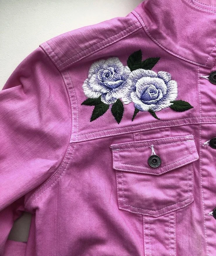 White roses on pink denim