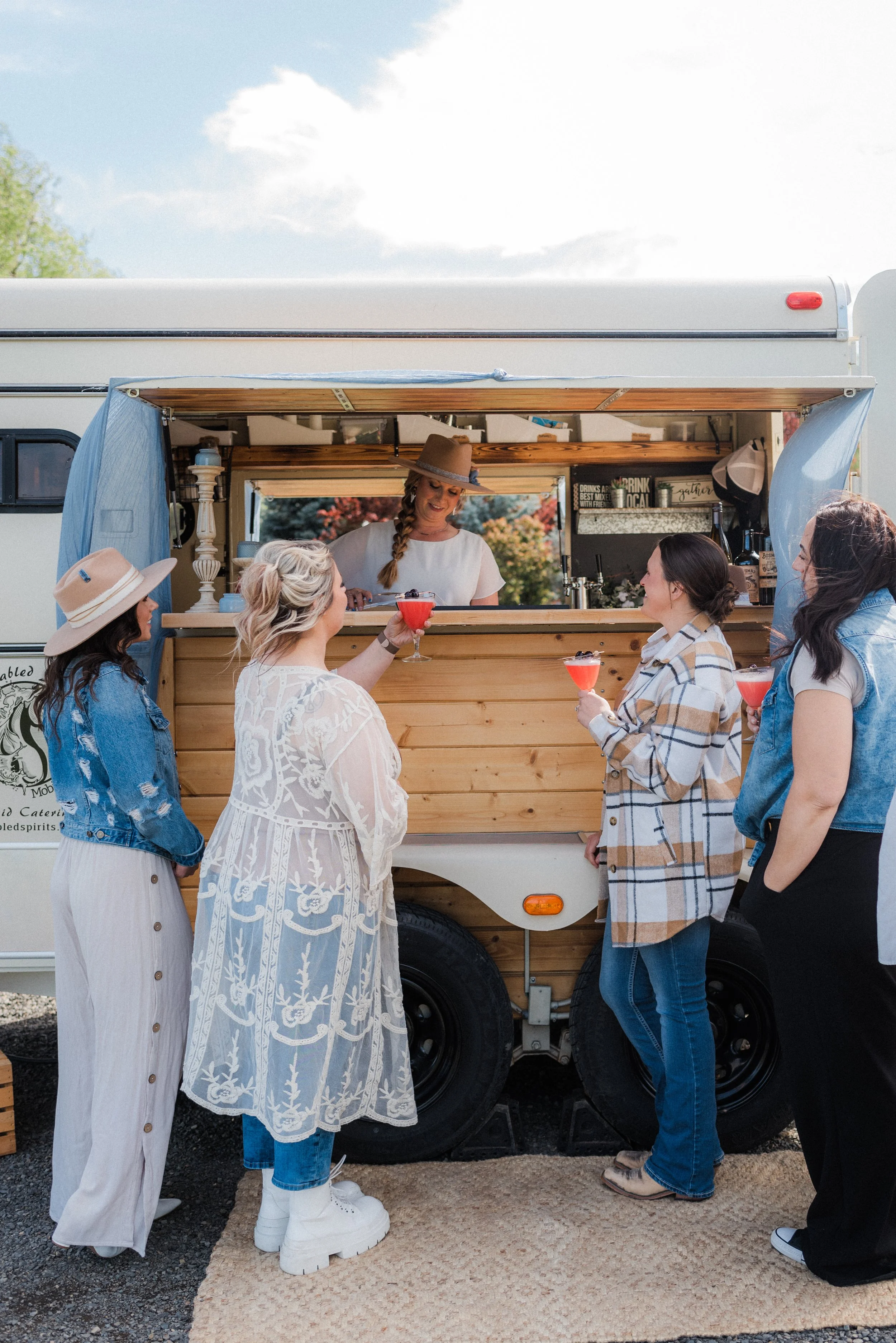 Aubrey from Unstabled Spirits Mobile Bar Co. serving delicious drinks at our May 2024 Styled Shoot.  Photo by Tiffany Sukola.