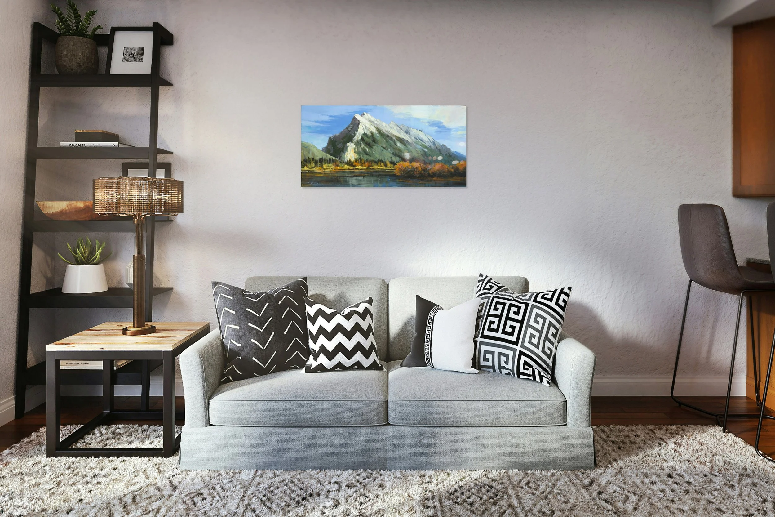 Mount Rundle Peak by Martin Pryce, unsigned print above a grey sofa with patterned cushions