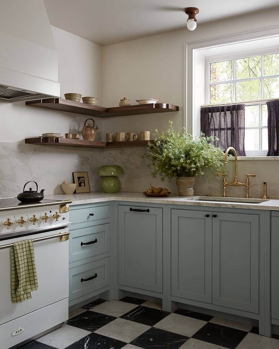 Luxury kitchen in Philadelphia by Vestige Home with pale blue cabinets, marble counters and a checkerboard marble floor