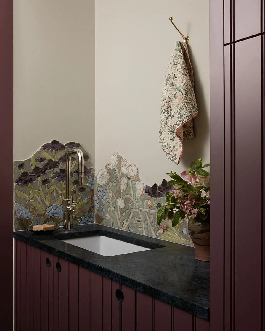 Hand-painted floral mosaic backsplash and soapstone counter in a Philadelphia laundry room by Vestige Home