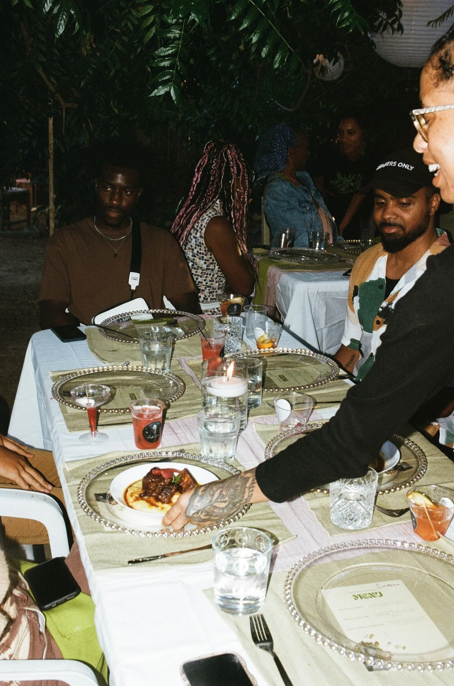 Vol. I, a happy table. Chef T delivering the short rib second course. Photo Cred. Nandi George