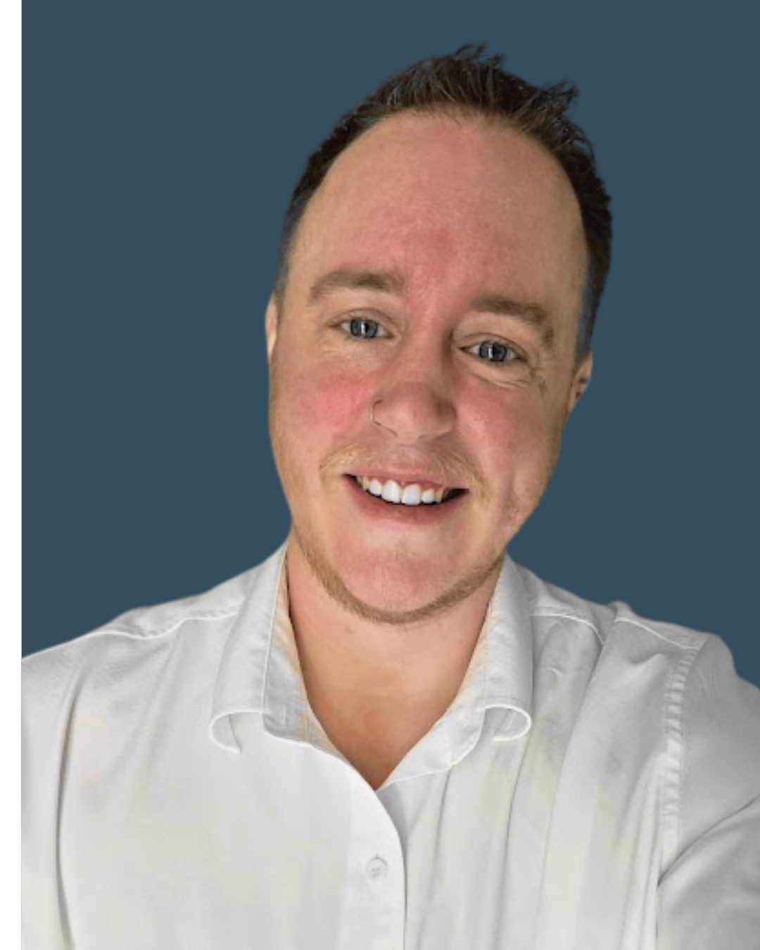 Man in white shirt, head tilted, smiling