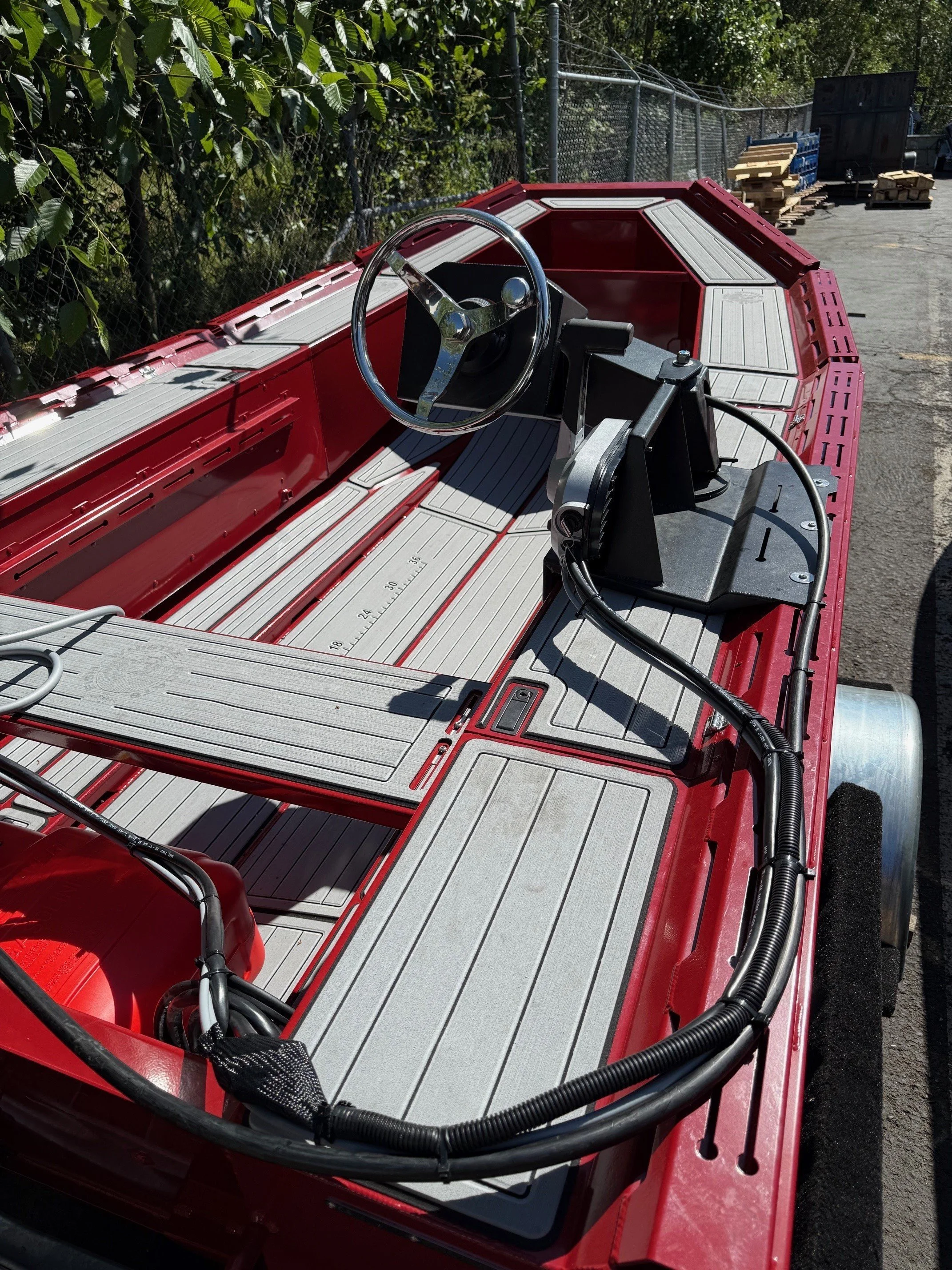 fish whistle aluminum yacht tender with swing away side console helm steering wheel and bench seat