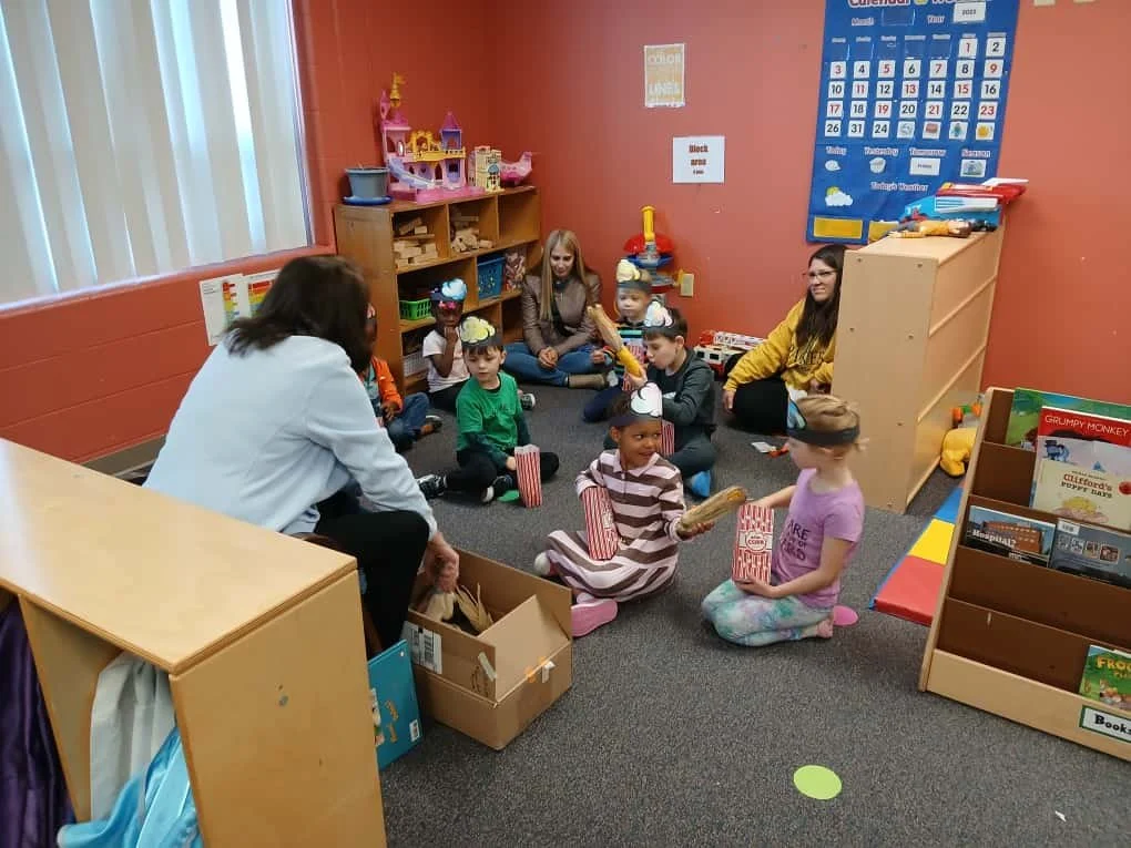 🍿 Storytime & Popcorn Fun! 📚
Local author Cynthia Schumerth visited a few of our early childhood classrooms to read Let’s Pop, Pop, Popcorn! 
Kids enjoyed popcorn, stickers, and thanks to a generous donation from our childcare parents,