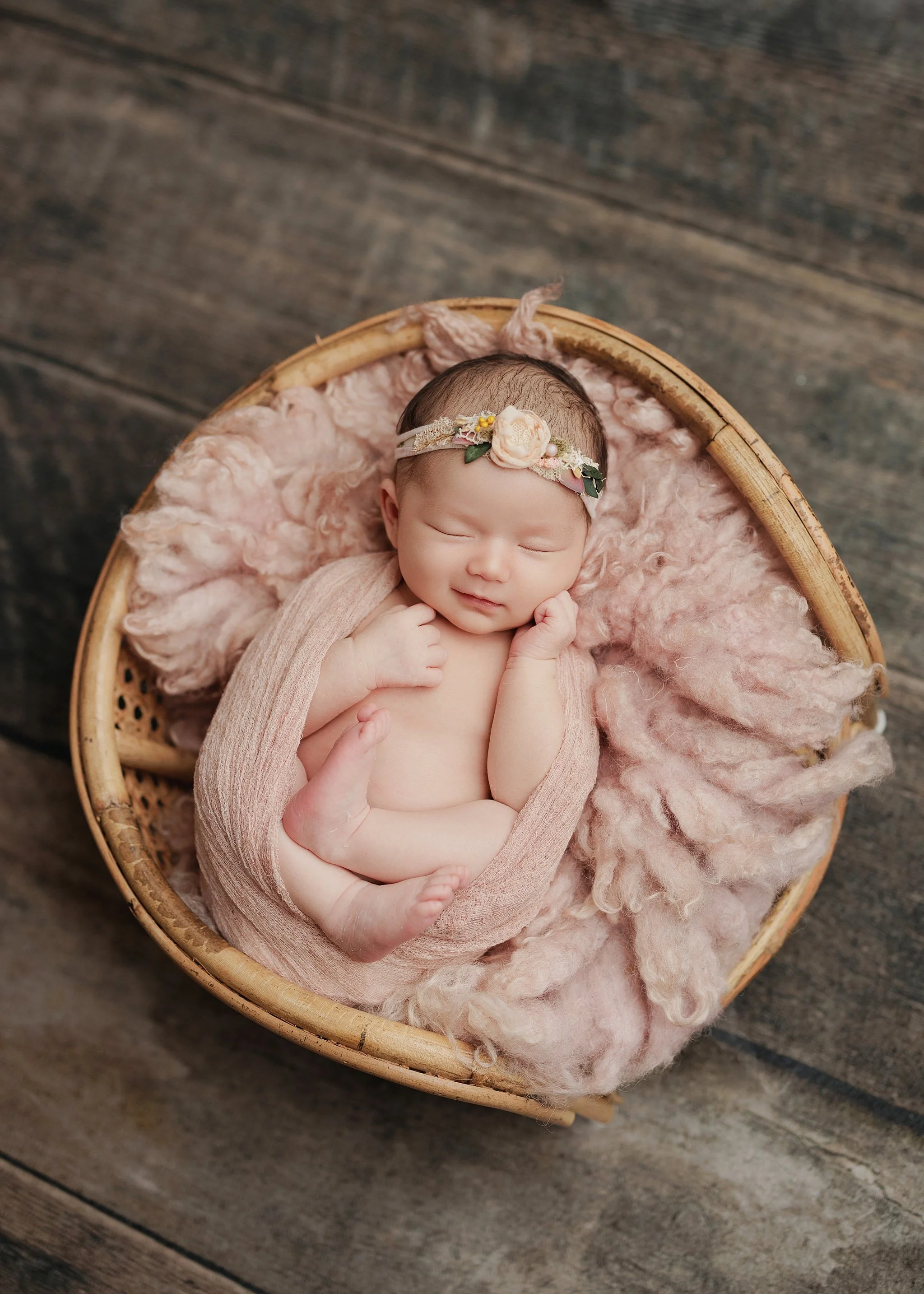 half wrapped baby girl in pink