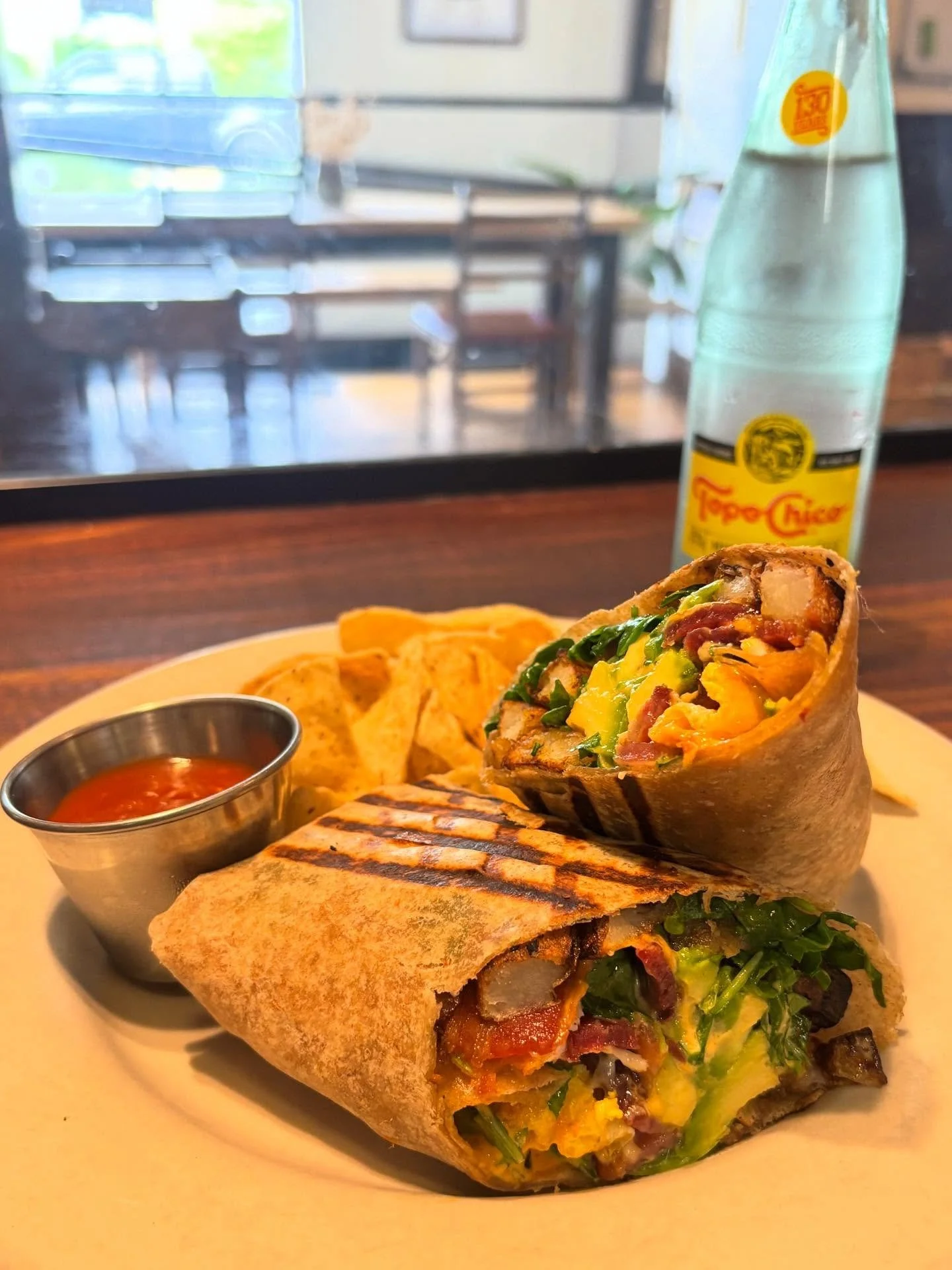 Burrito week has begun!! For only $9 you can get this delicious burrito filled with fried eggs, roasted potatoes, melted cheese, arugula, bacon OR avocado and our house sriracha aioli. We call it The Bear Hug because it will make you feel warm and co