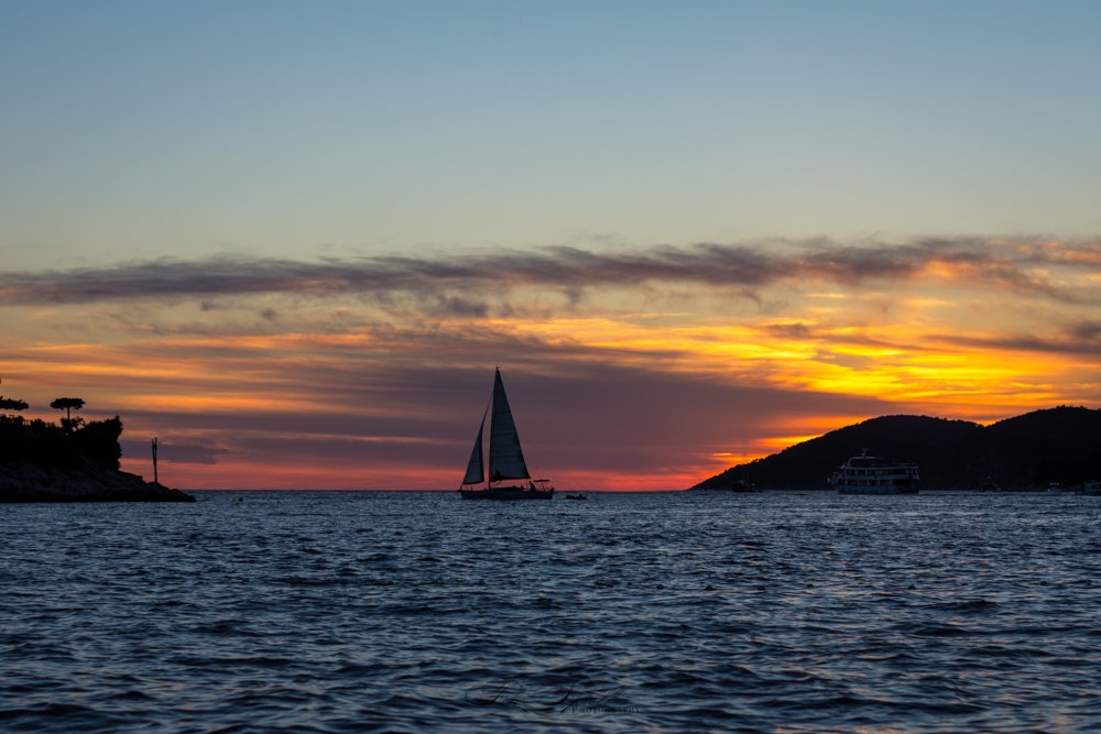 Sailing boat at sunset in Hvar