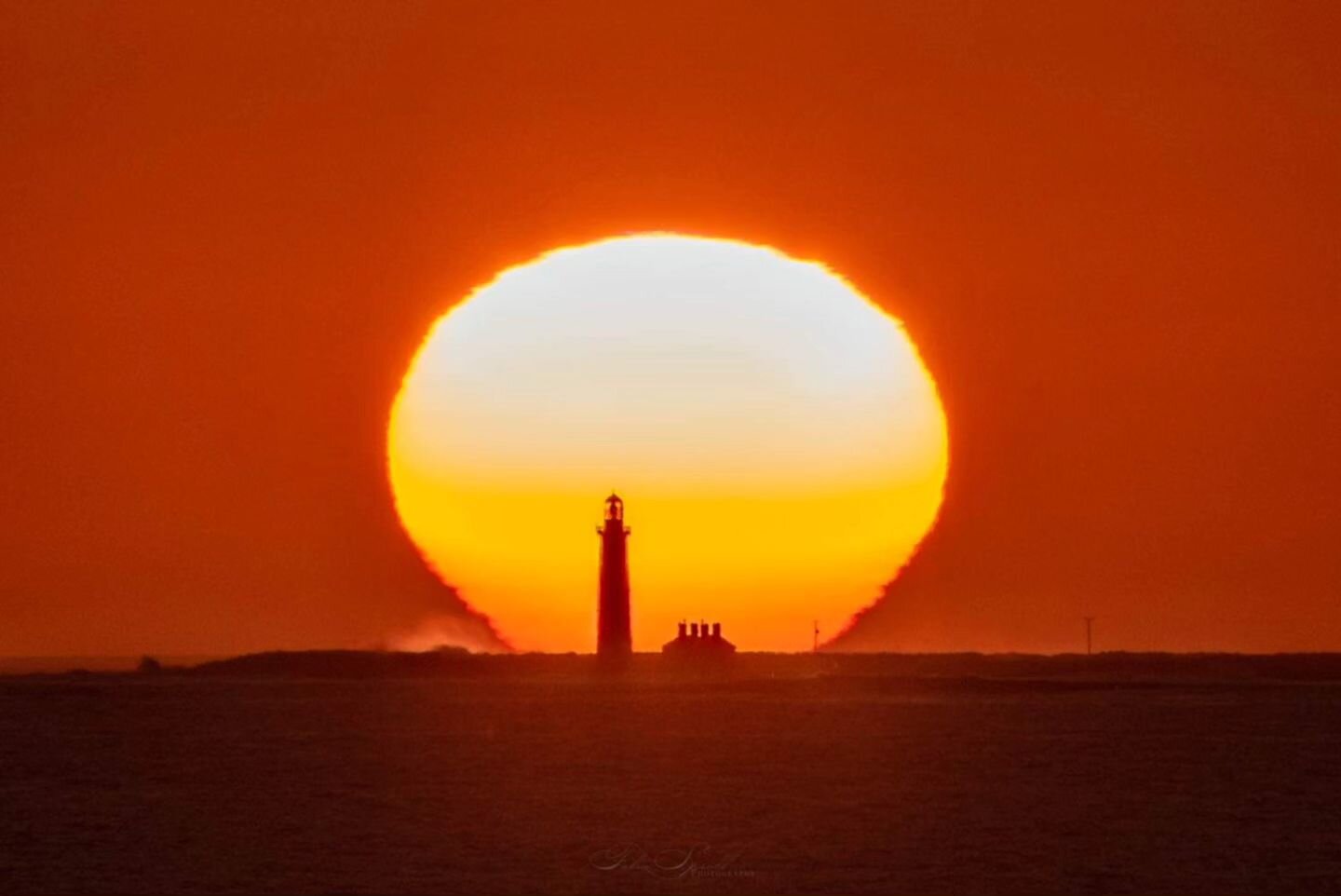 The sun setting behind Inisheer Lighthouse on the Aran Islands. The earth's atmosphere fairly distorts the sun and it almost looks fake with the shape as it got lower. Planned with @photopills but still a bit of running to keep it all lined up. #aran