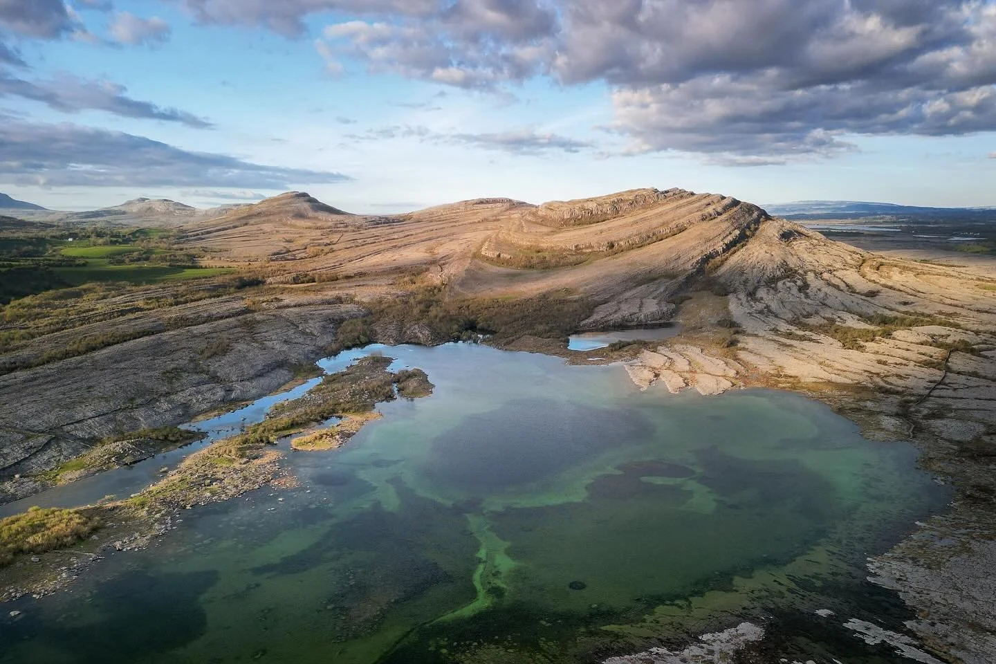 Birds Eye view of the Burren National Park. This amazing place transforms between summer and winter when the lakes appear and disappear. It&rsquo;s looks extra cool with the drone to see all the structure in the lake and limestone folds. #burren #bur