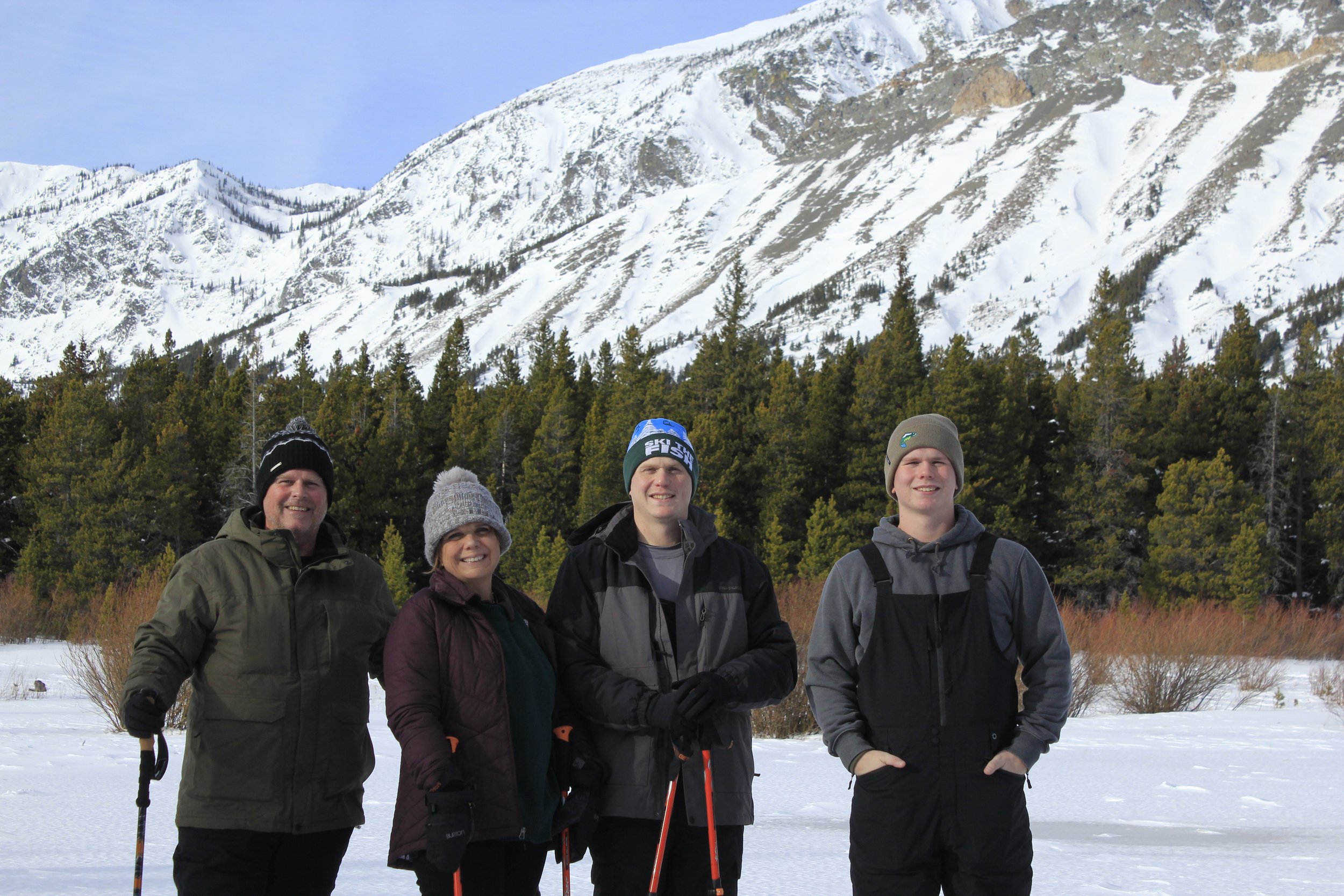 4 people snowshoeing in Glacier National Park