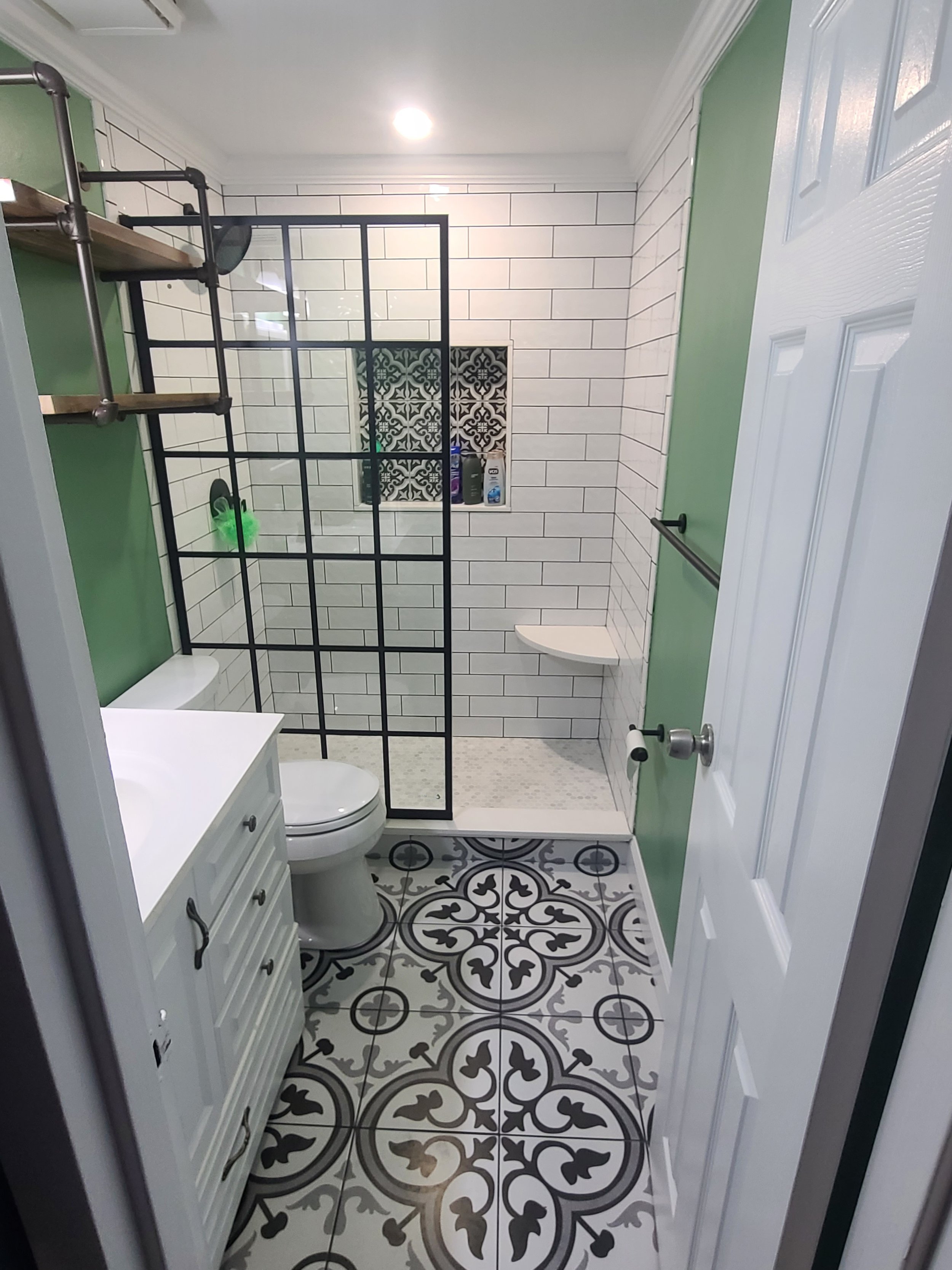 Bathroom-small-modern-pattern-tile-niche-no-door-white-and-black-floating-bench-crown.jpg