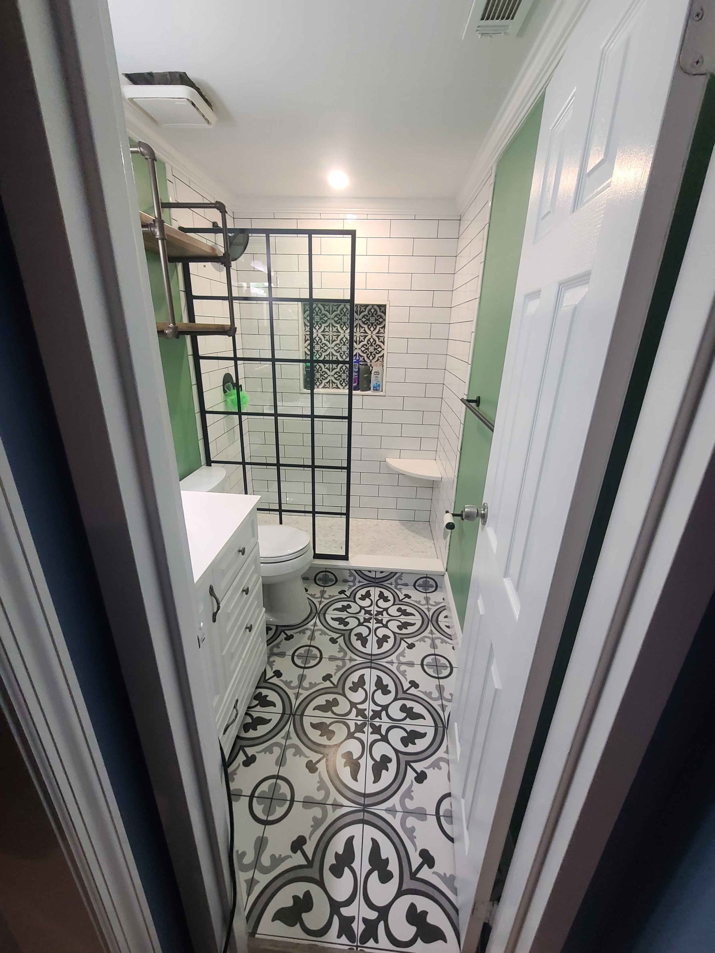 Bathroom-small-modern-pattern-tile-niche-no-door-white-and-black-floating-bench.jpg