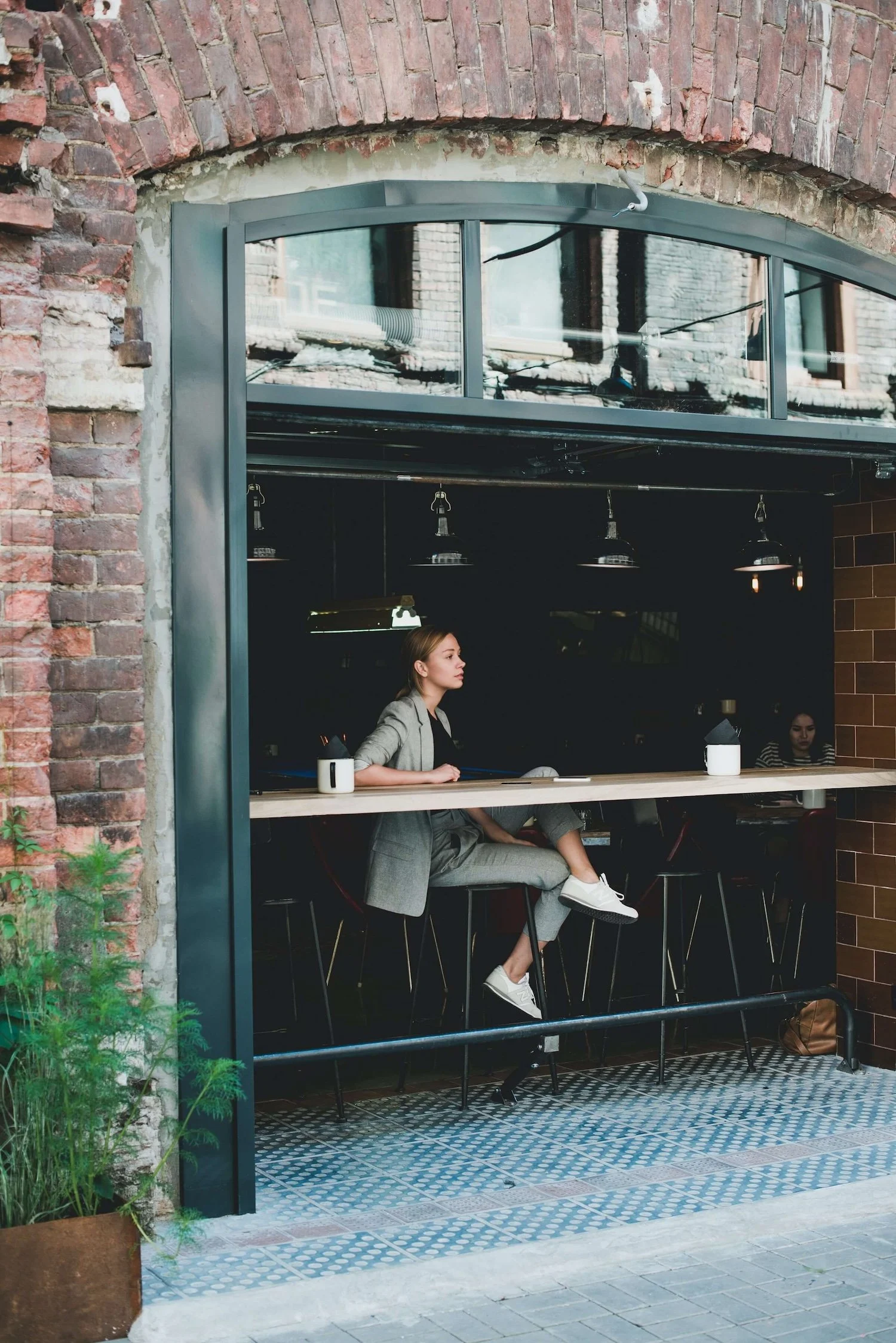 woman sitting at coffee bar window