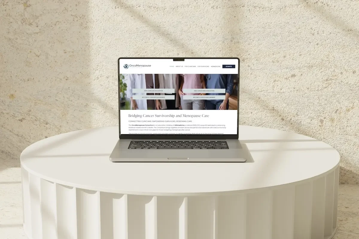 OncoMenopause Consortium homepage on MacBook — Squarespace nonprofit website design for HERmedicine initiative by Jennifer Mager Creative