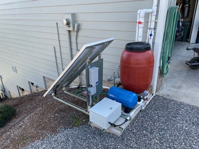 Solar irrigation panel, pump, and water barrel