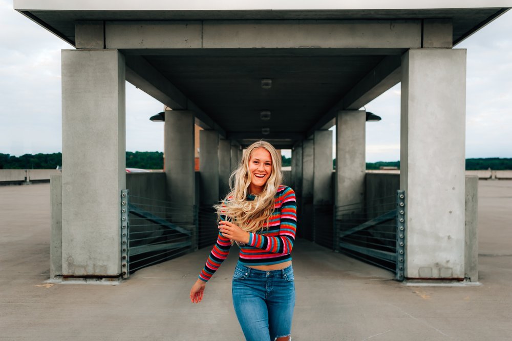 high school senior girl laughs in downtown wausau wisconsin