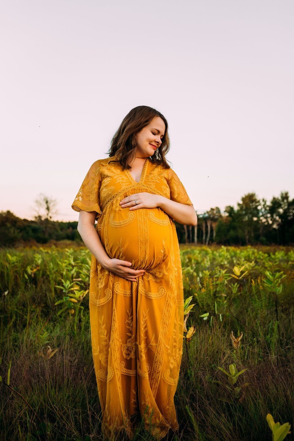 women chooses yellow dress to wear for maternity session