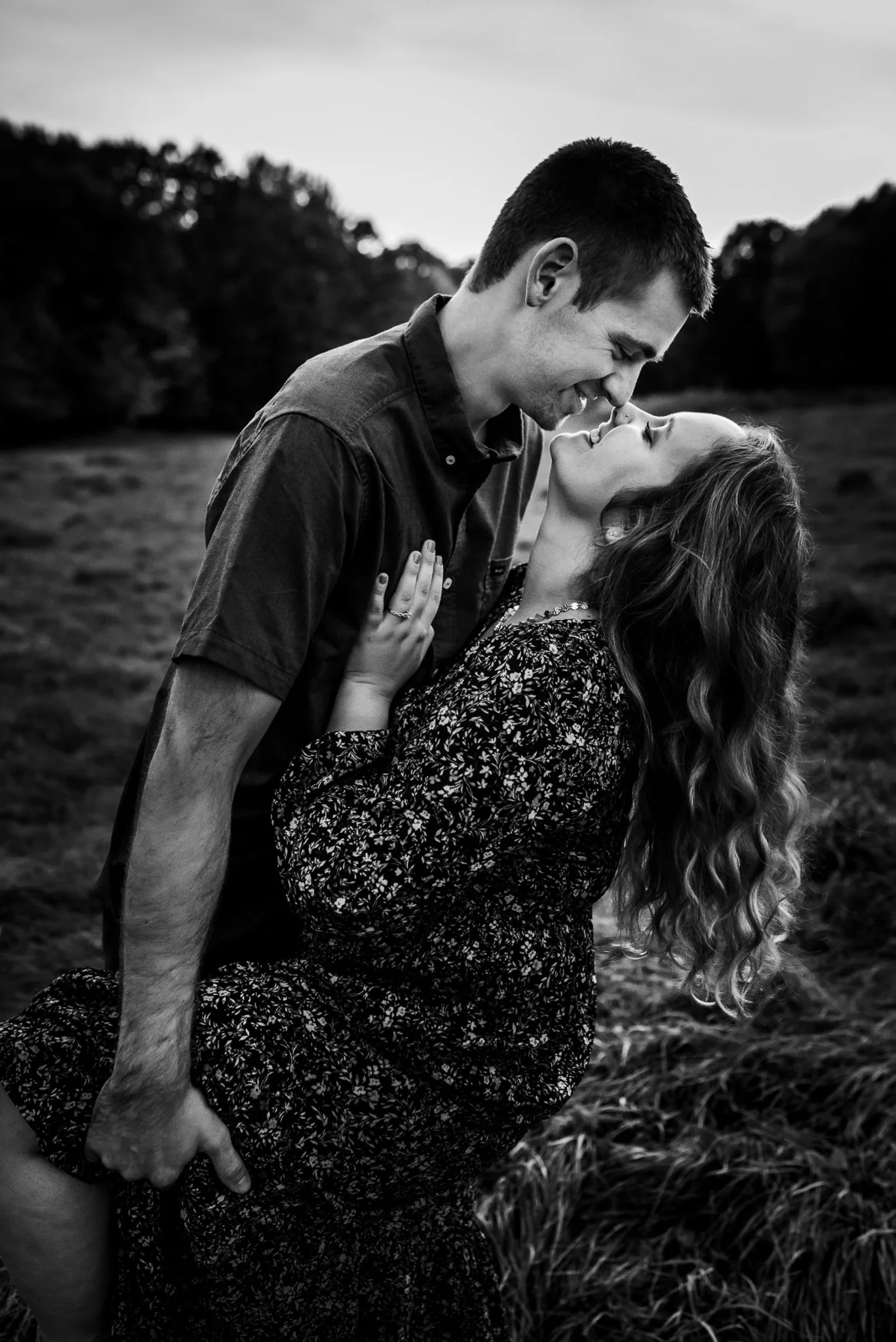 engaged couple kisses at their engagement photo session  in Wausau Wisconsin