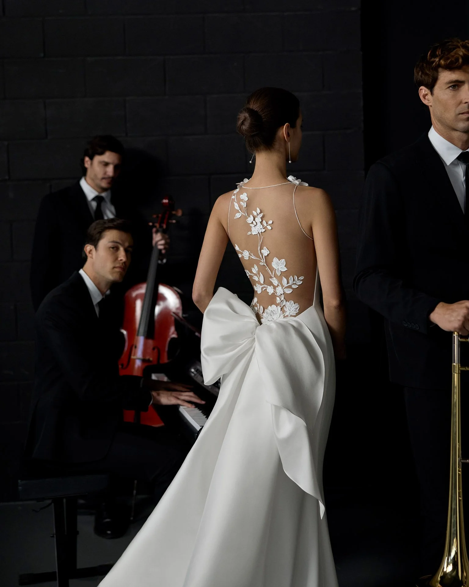 Woman wearing an Aire Atelier wedding dress with painted sheer back