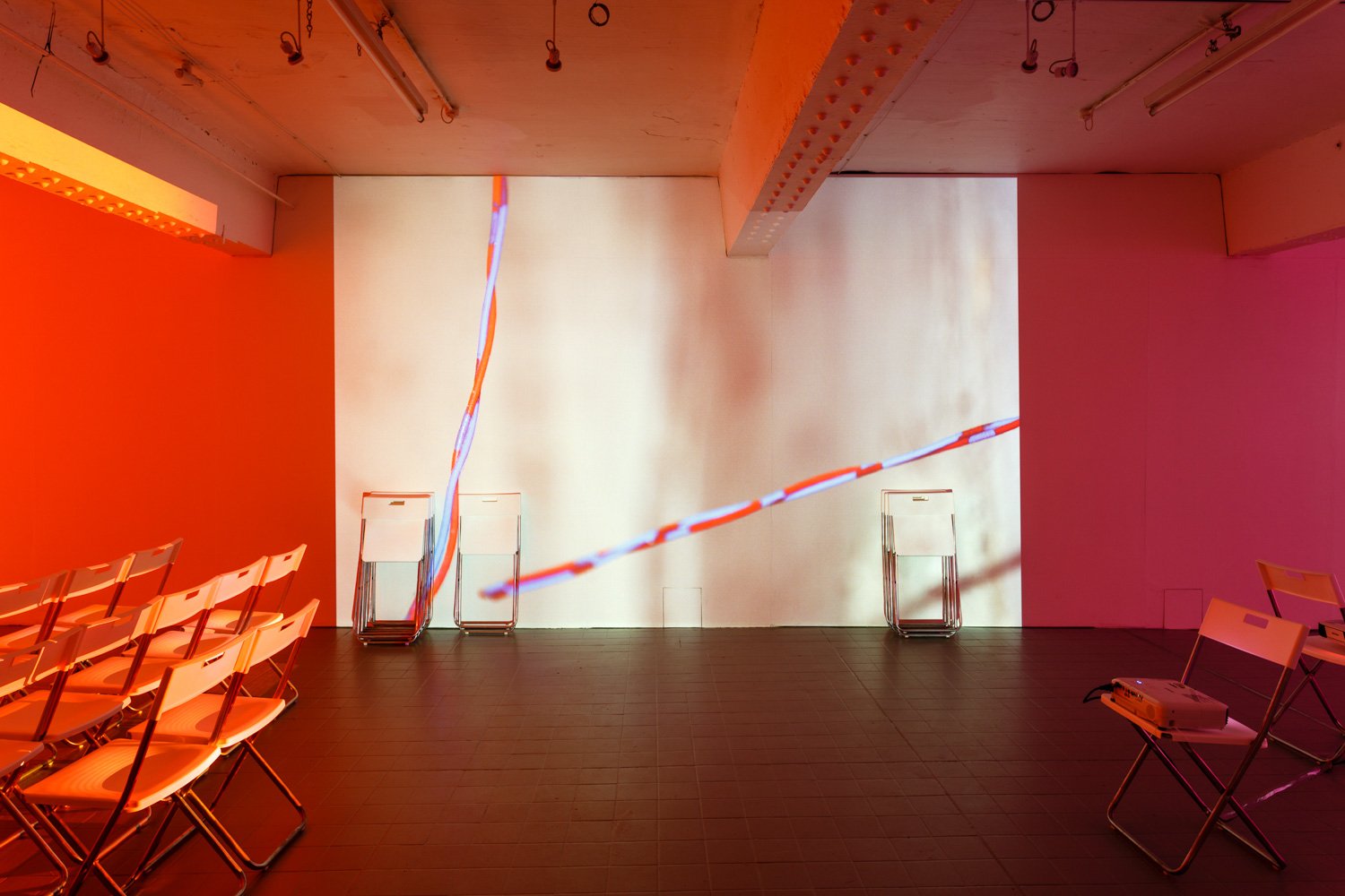 Assembly, 2016, projection (looped series of 147 stills for each of three projectors), chairs, dimensions variable