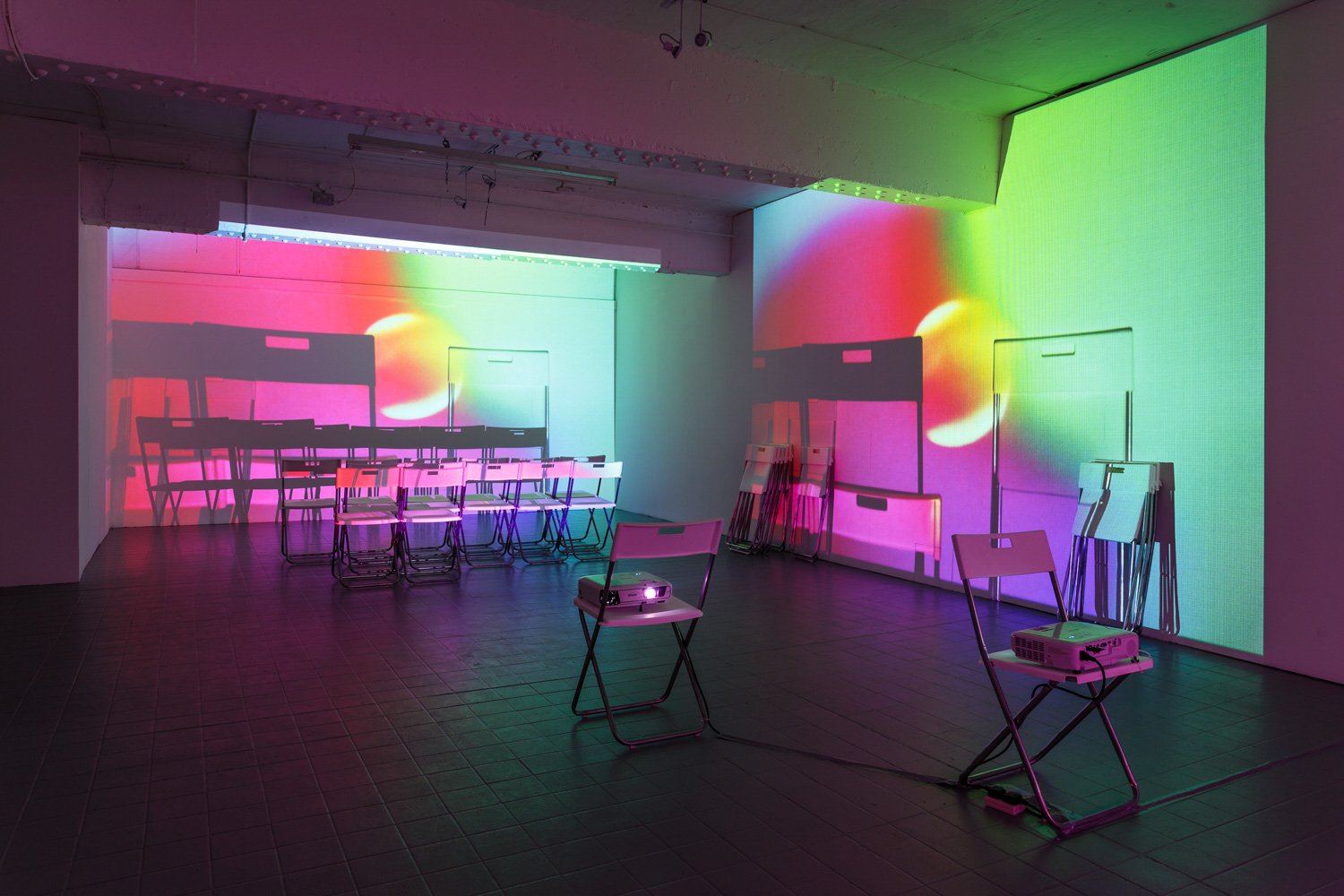 Assembly, 2016, projection (looped series of 147 stills for each of three projectors), chairs, dimensions variable