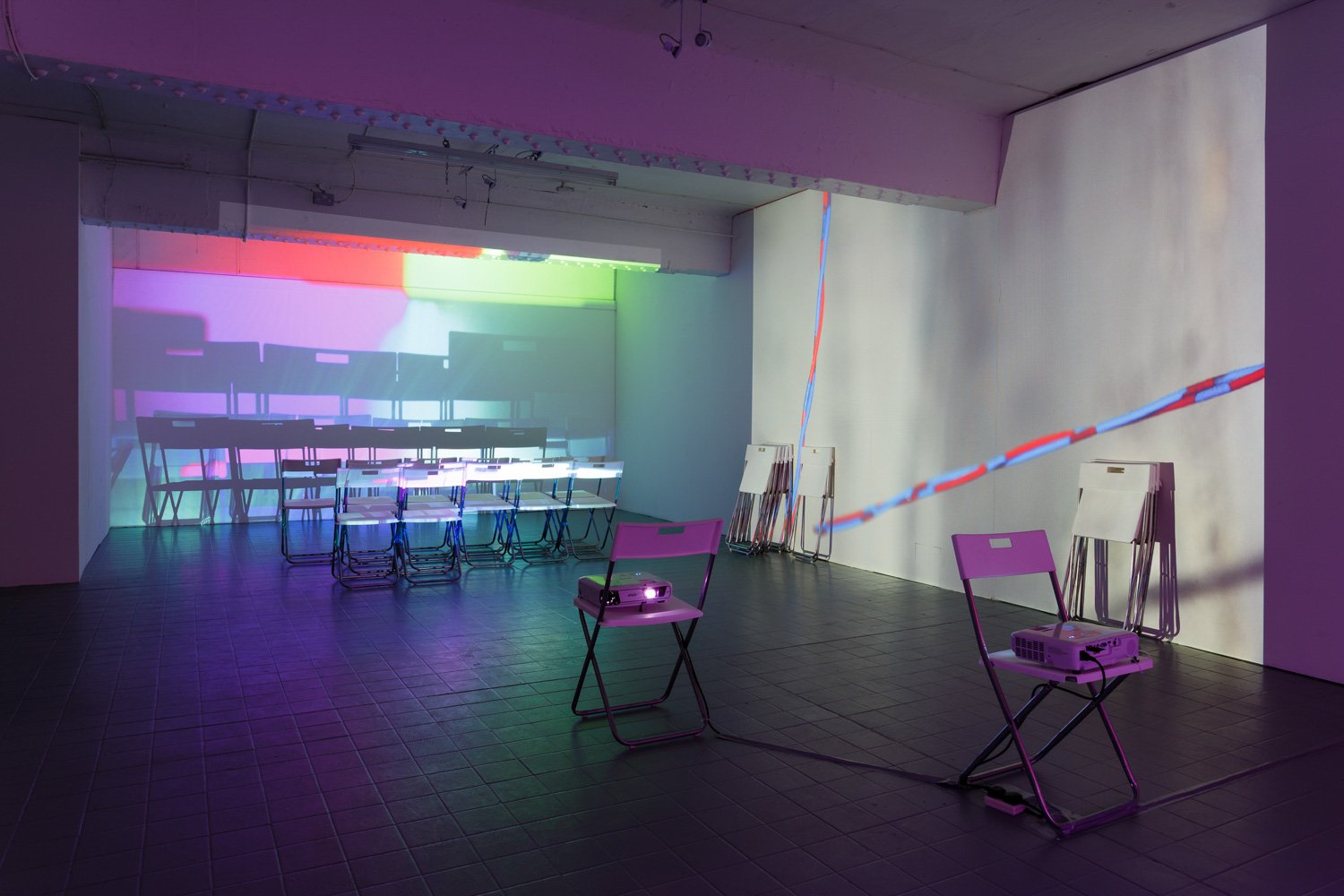 Assembly, 2016, projection (looped series of 147 stills for each of three projectors), chairs, dimensions variable
