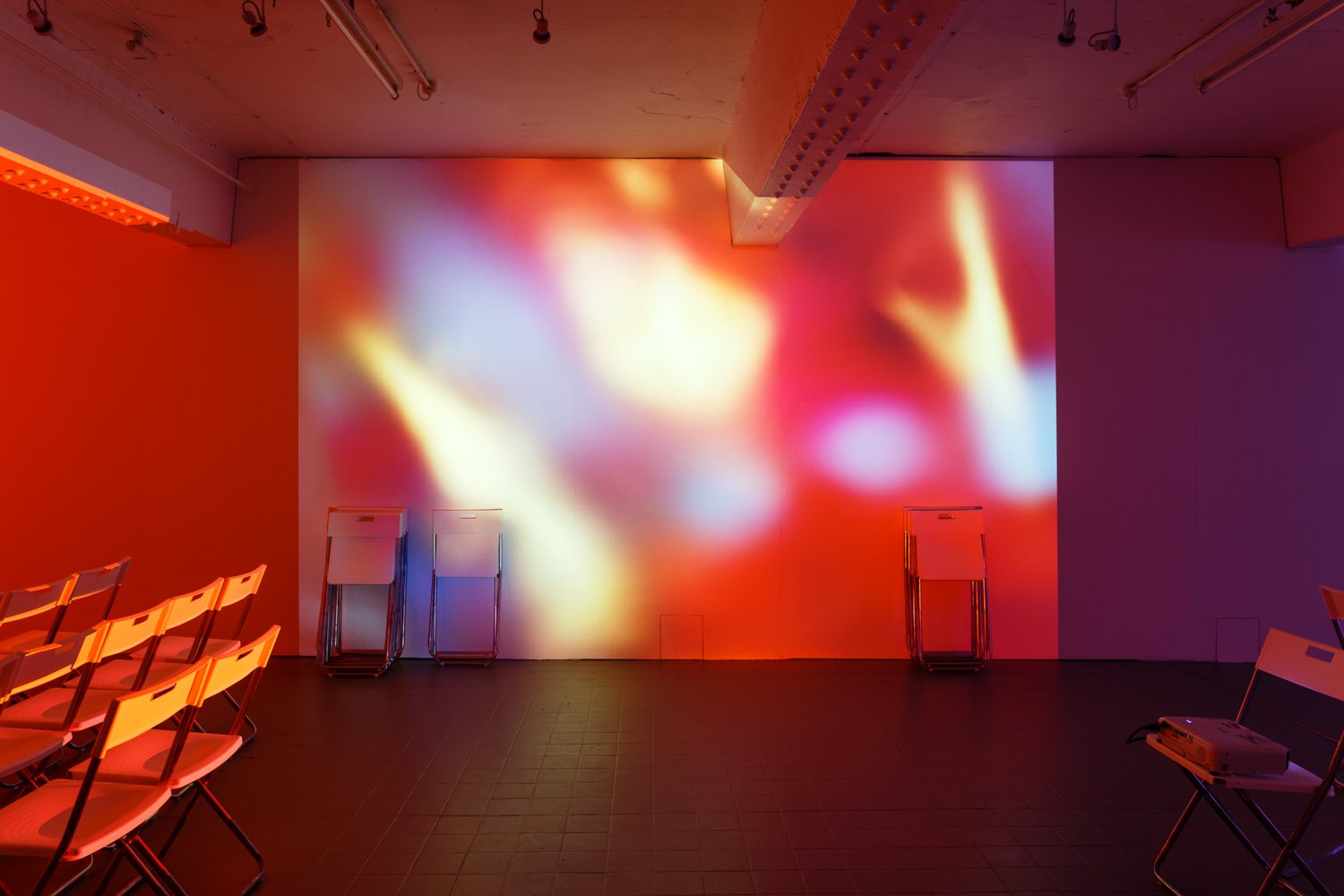 Assembly, 2016, projection (looped series of 147 stills for each of three projectors), chairs, dimensions variable