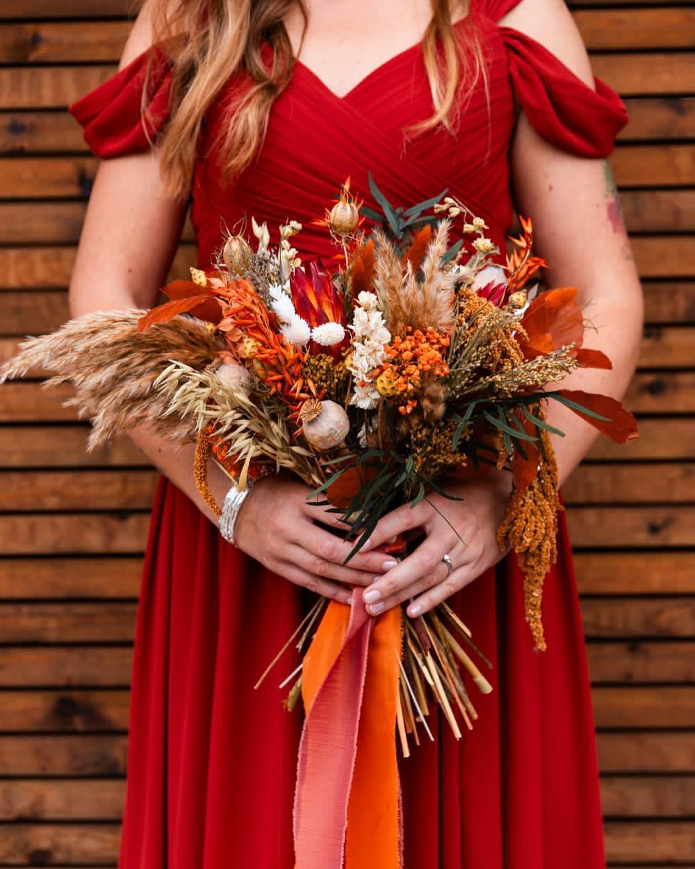 Bridesmaids bouquets in red and orange and yellow and gold and spice and tan and green. ❤️🧡💛💚

📸: @capturedbycorinne 
.
.
.
.
#prettypricks #driedflowers #driedbouquets #driedbouquet #bridesmaidbouquets #stokeontrentflorist #staffordshireflorist