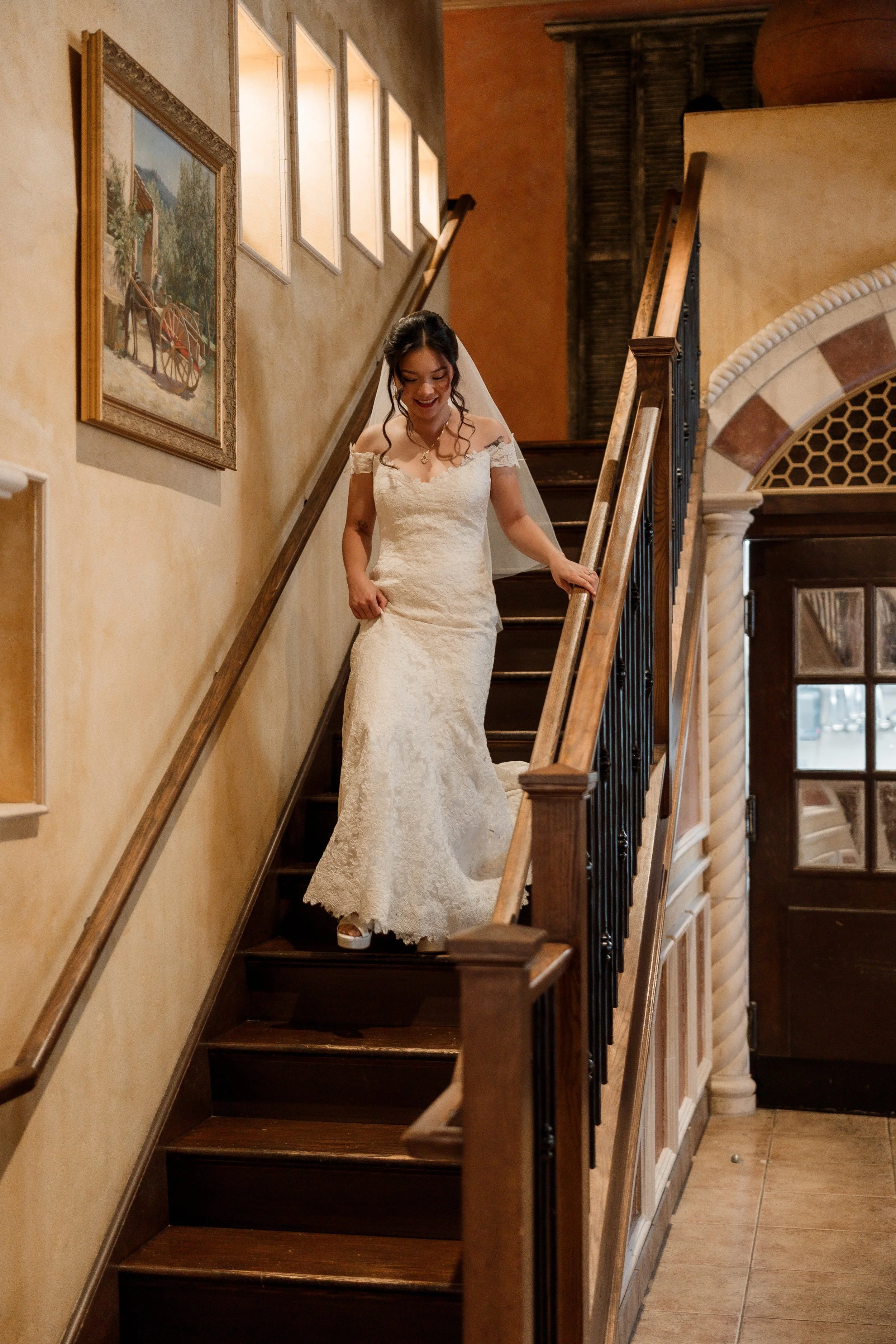 Bride walking down the stairs at Galleria Marchetti wedding in Chicago