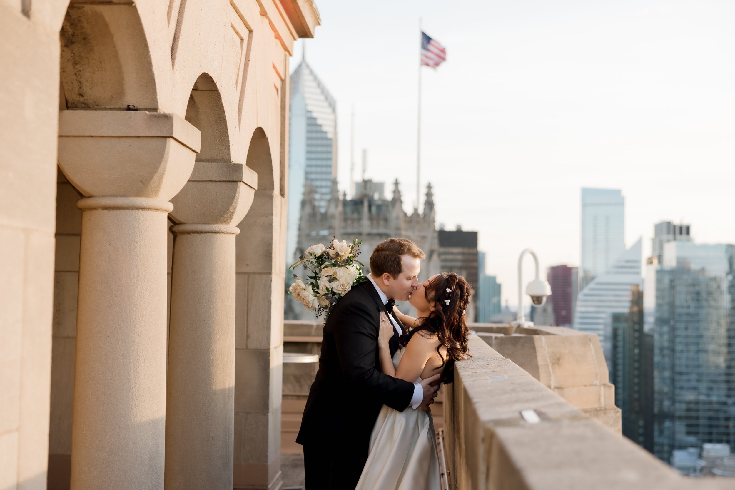 Couple kissing at InterContinental Chicago wedding on the rooftop