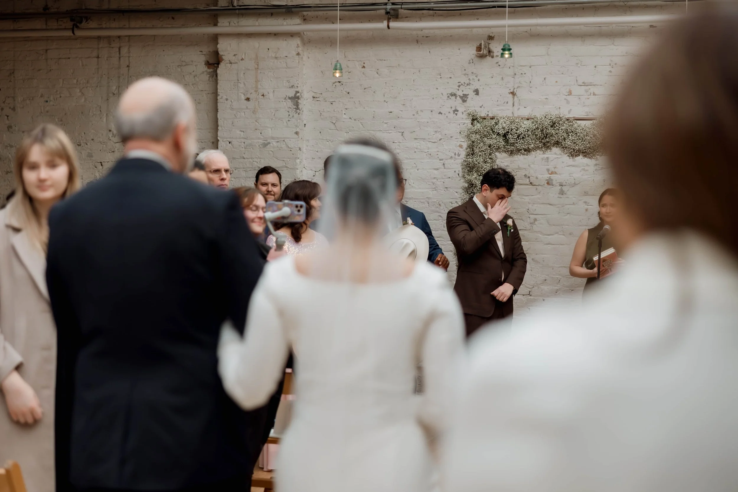 Emotional groom as bride walks down the aisle at The Joinery