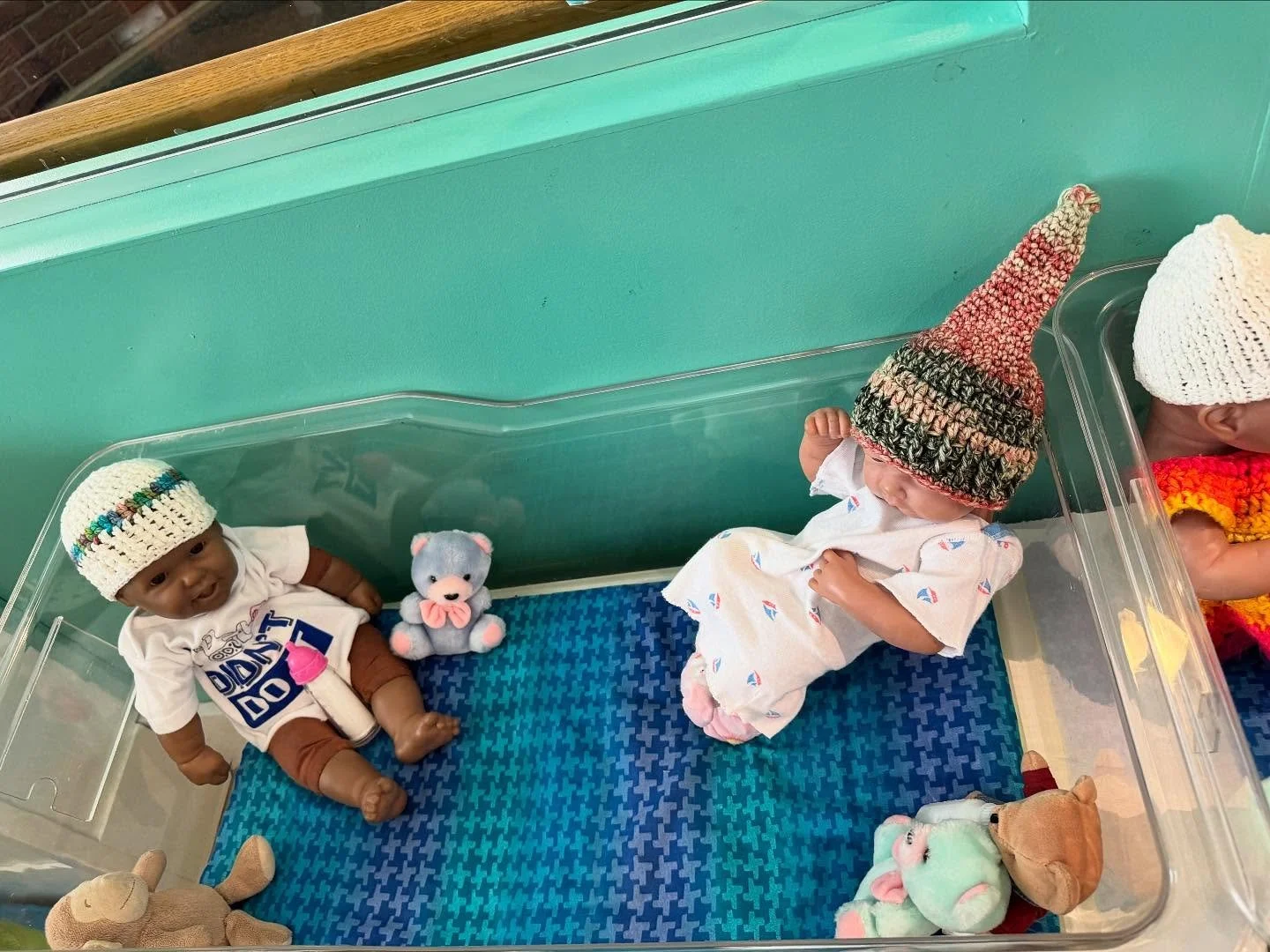 We have some wonderful volunteers at Sandcastles. Currently, the Knittin at the Mitten group is making hats and Clothes for our babies at Sandcastles! Thanks for bringing in the first set of hats, Judy and Chris Dunn! We also have Shirley Peterson br