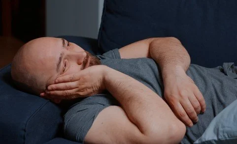 man awake and concerned