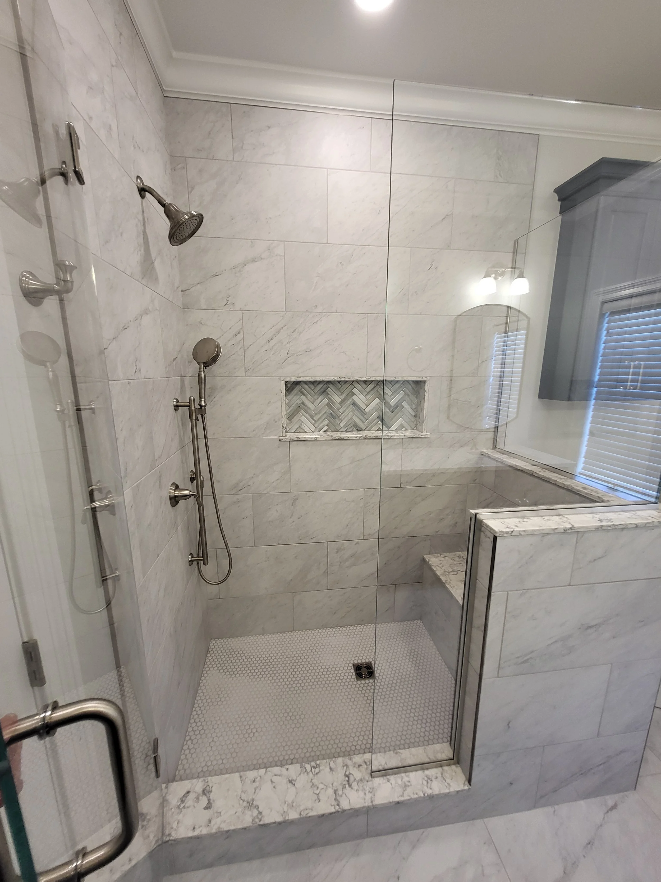 Walk in shower with glass walls.jpg